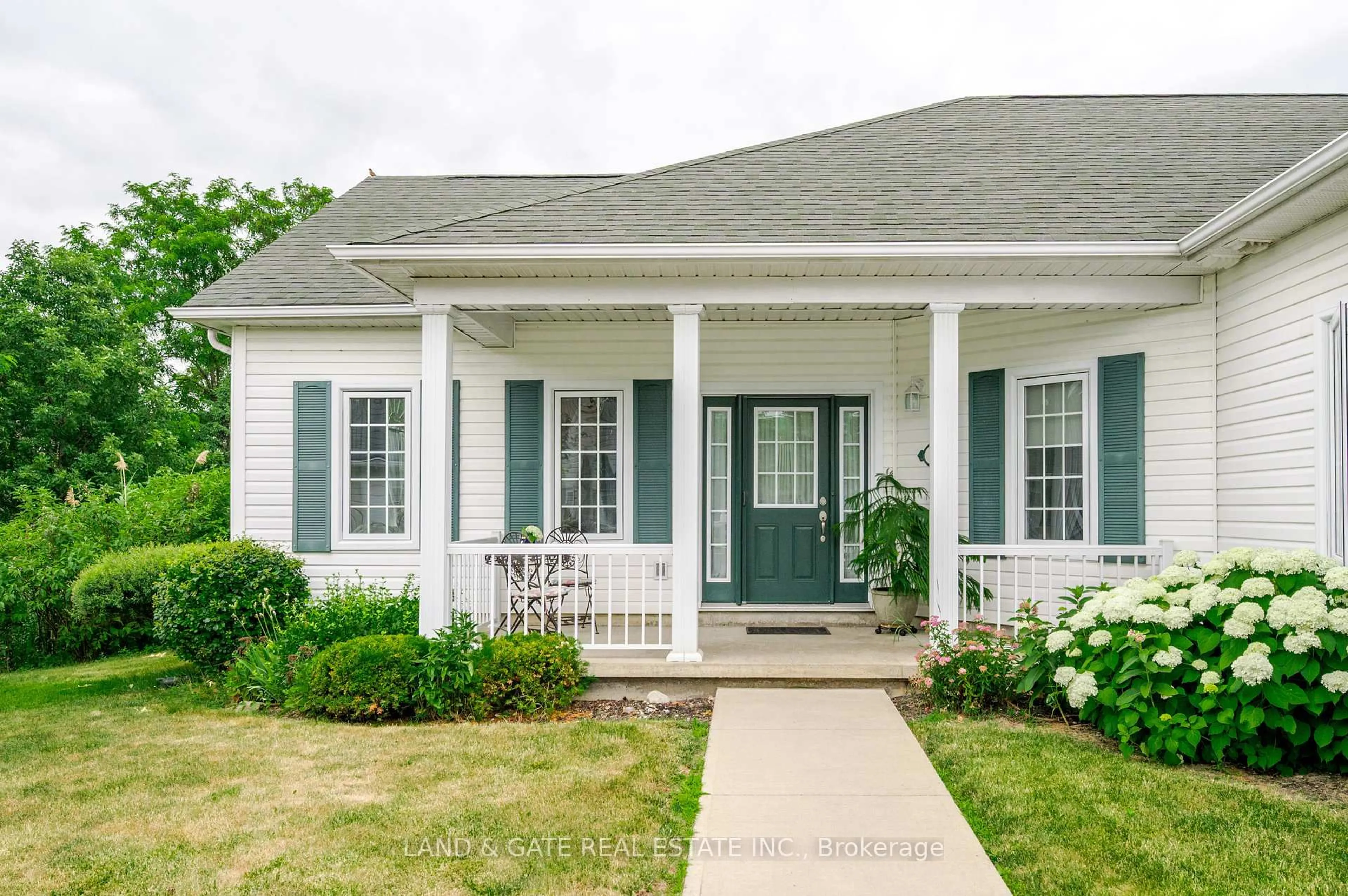Home with vinyl exterior material, street for 325 Densmore Rd #503, Cobourg Ontario K9A 0E4
