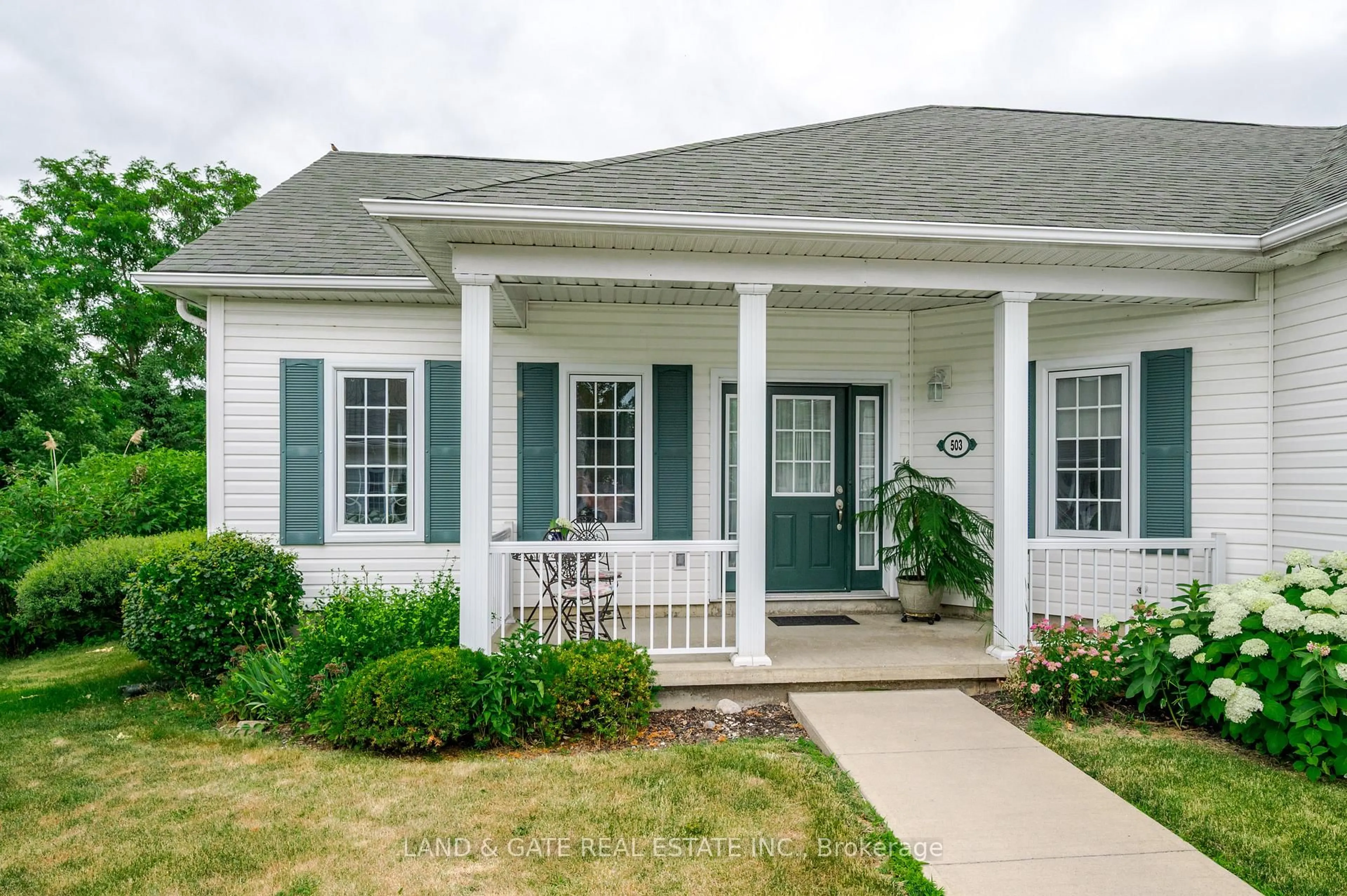 Home with vinyl exterior material, street for 325 Densmore Rd #503, Cobourg Ontario K9A 0E4
