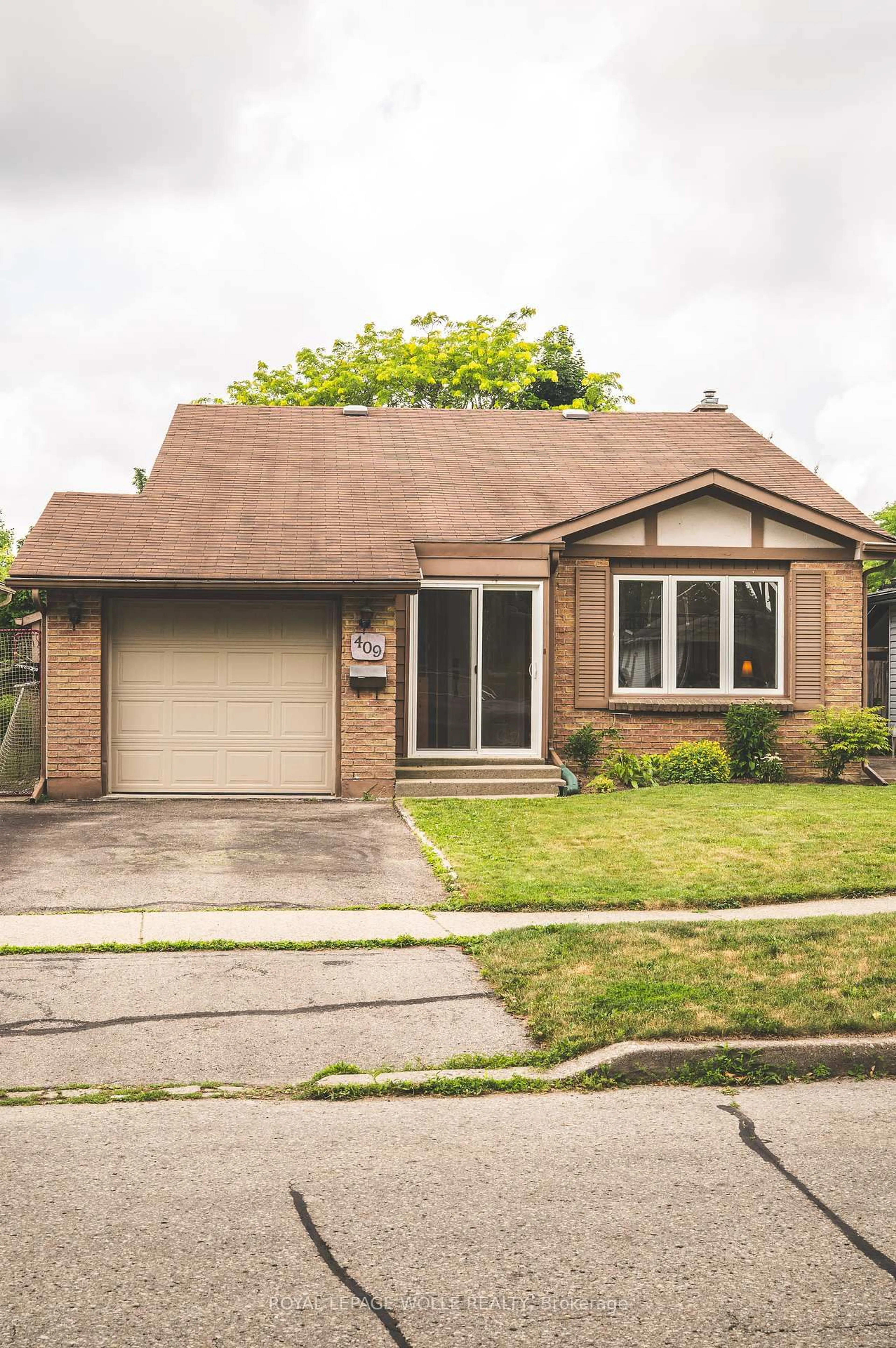 Home with brick exterior material, street for 409 Kane Dr, Waterloo Ontario N2K 2M7