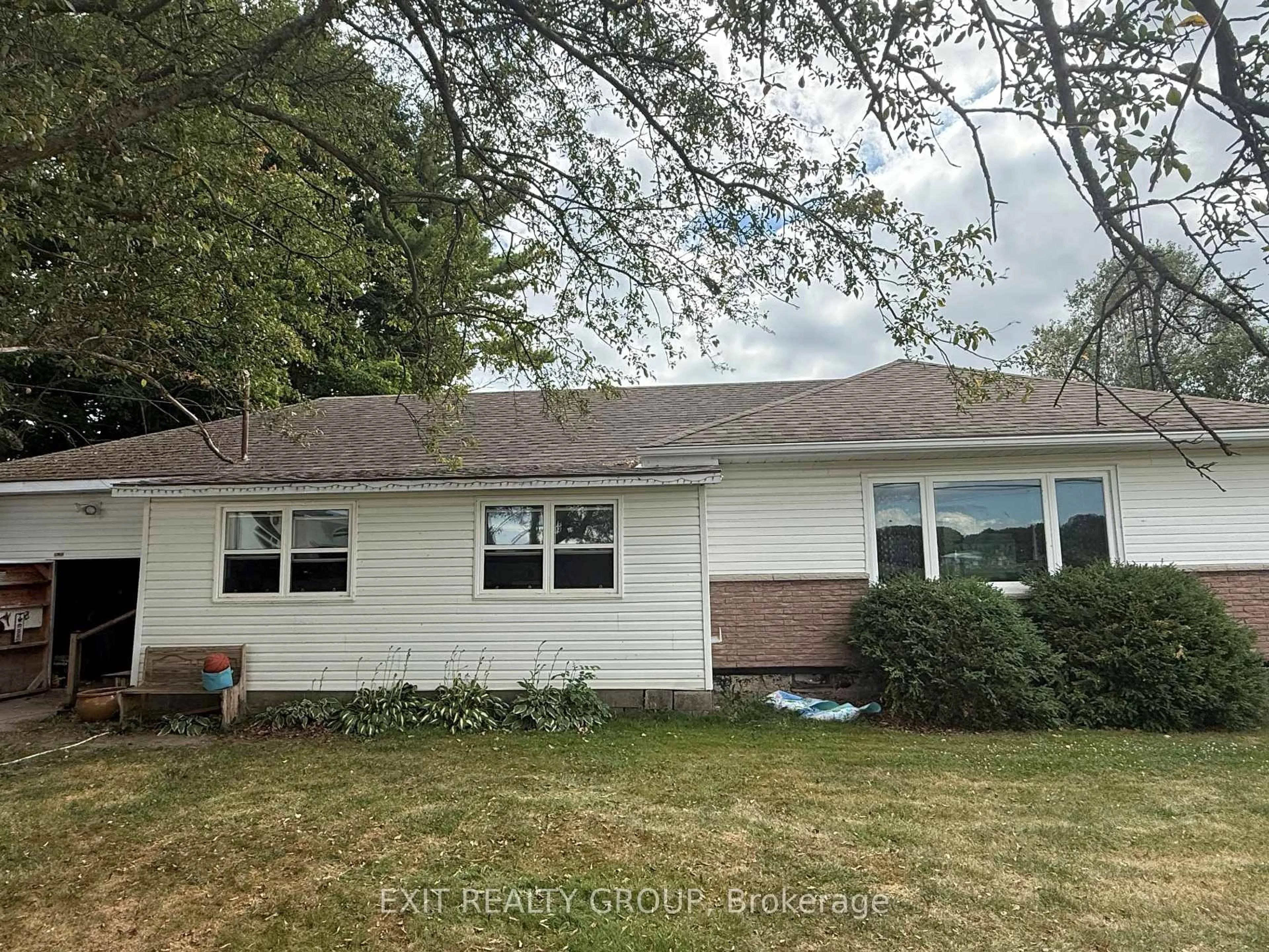 Home with vinyl exterior material, street for 1126 County Rd 10, Prince Edward County Ontario K0K 2T0
