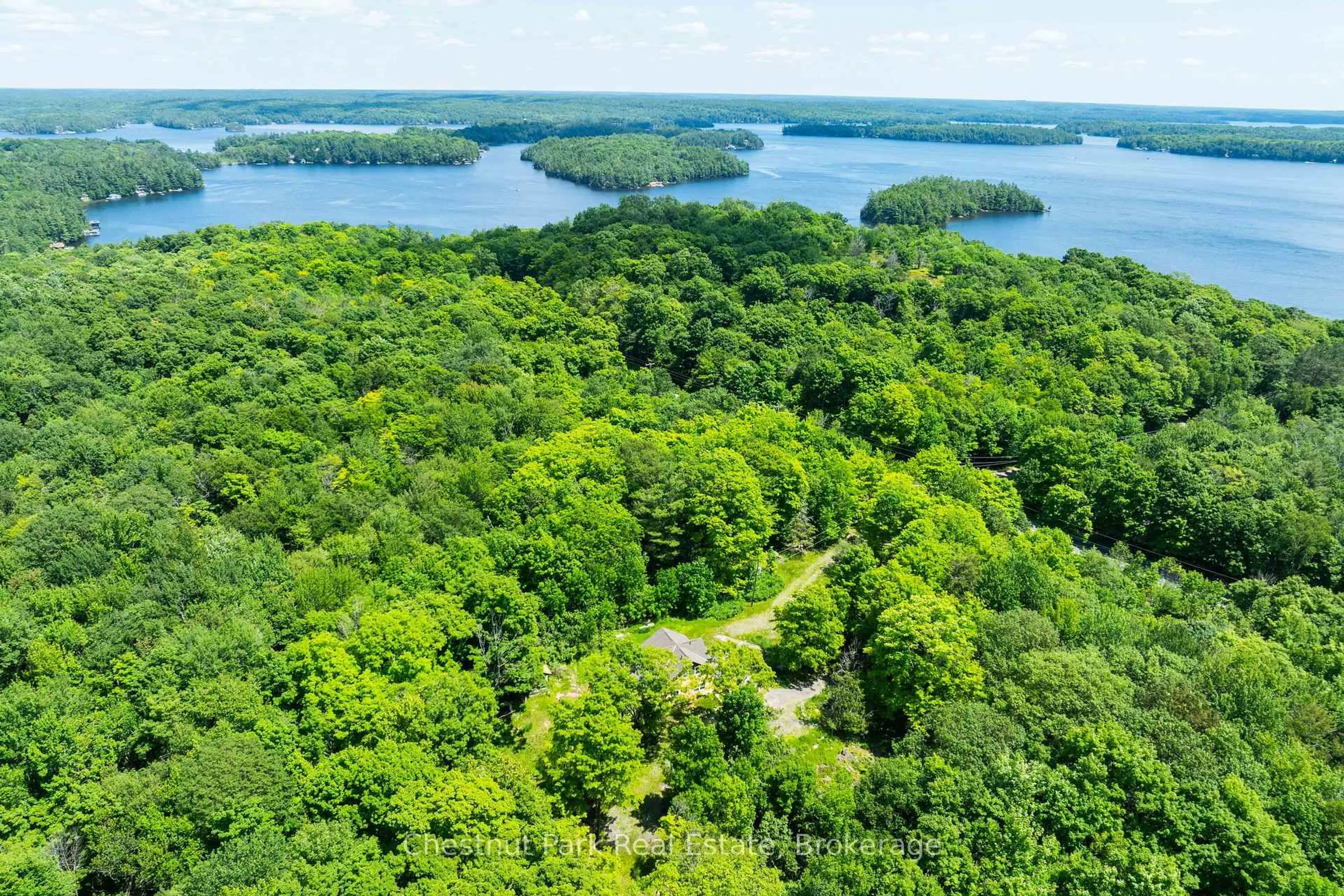 A pic from outside/outdoor area/front of a property/back of a property/a pic from drone, water/lake/river/ocean view for 1435 Juddhaven Rd, Muskoka Lakes Ontario P0B 1J0