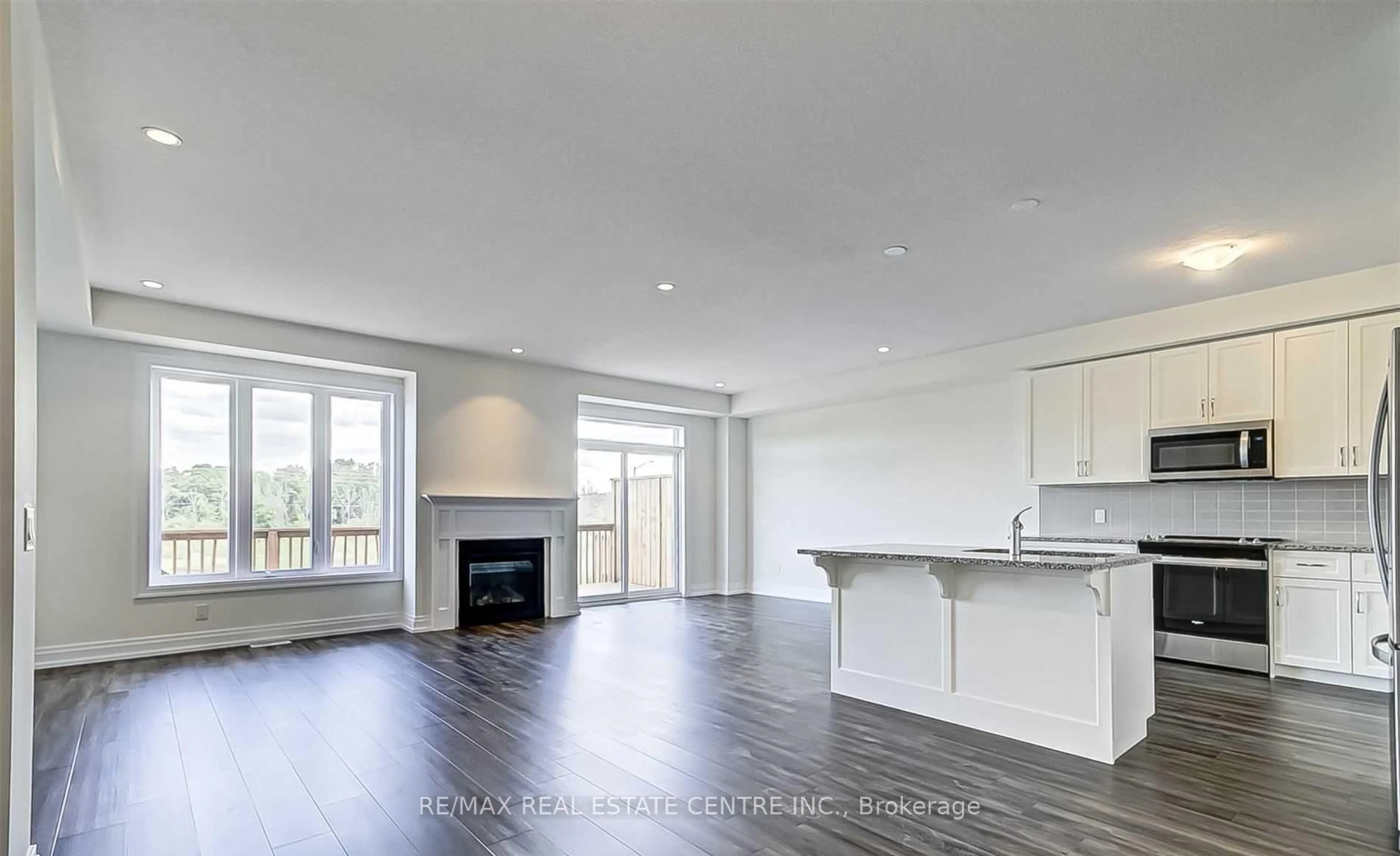 Open concept kitchen, wood/laminate floor for 64 Great Falls Blvd, Hamilton Ontario L8B 1Y5