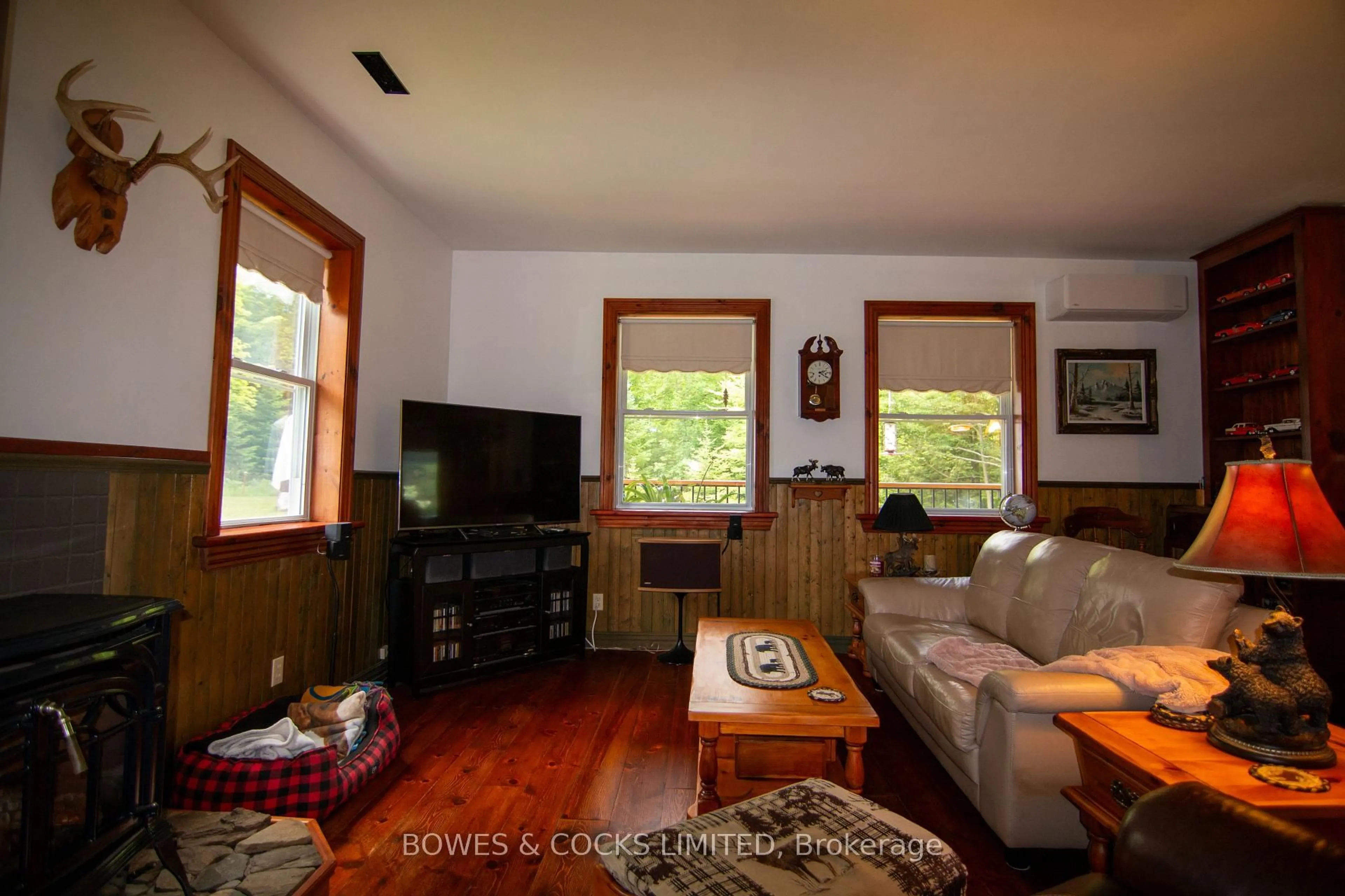 Living room with furniture, wood/laminate floor for 72 Jones Rd, Coe Hill Ontario K0L 1P0