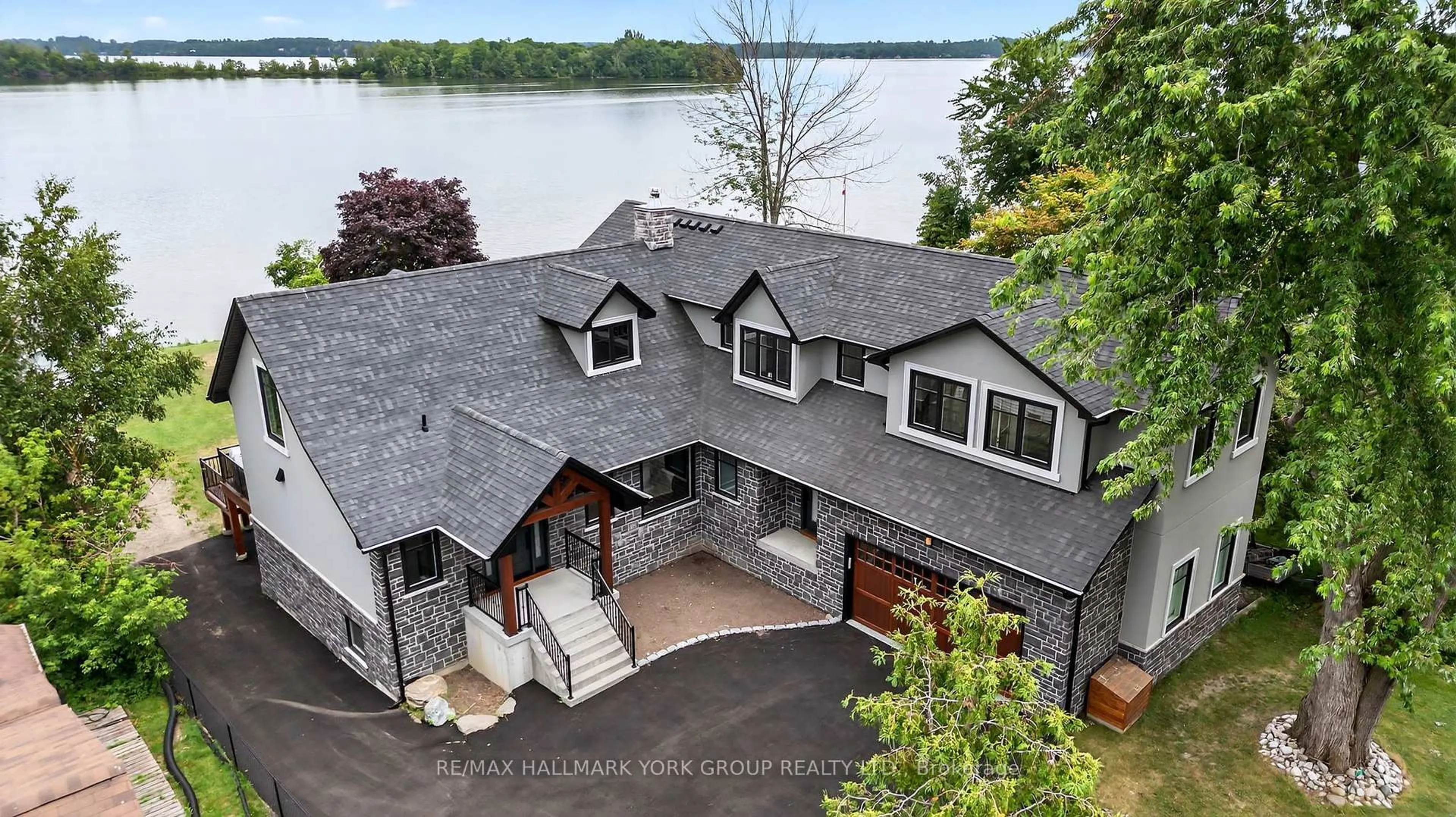 A pic from outside/outdoor area/front of a property/back of a property/a pic from drone, water/lake/river/ocean view for 10 Grills Rd, Kawartha Lakes Ontario K0M 2C0