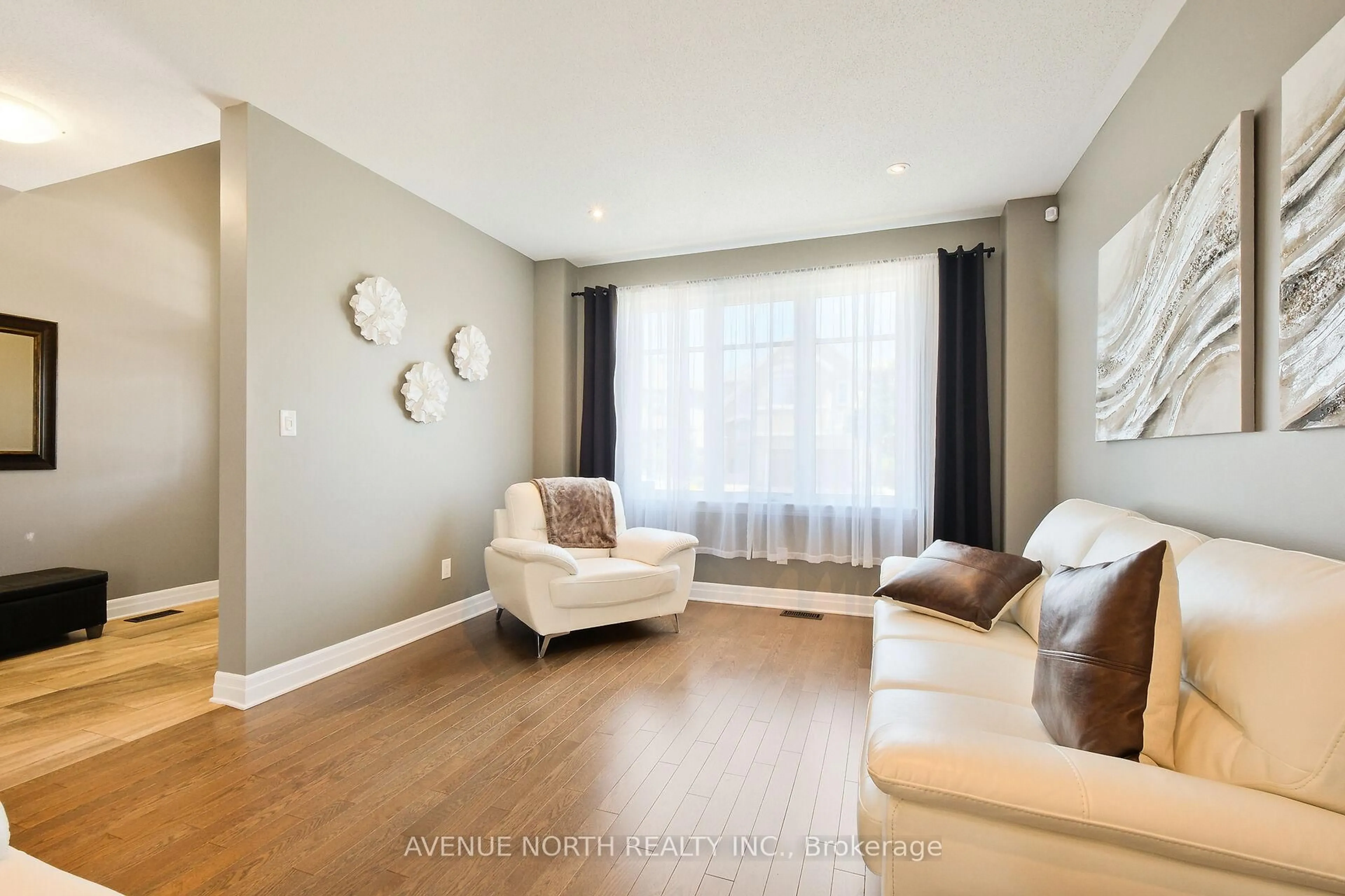 Living room with furniture, wood/laminate floor for 332 Andalusian Cres, Ottawa Ontario K2V 0C2