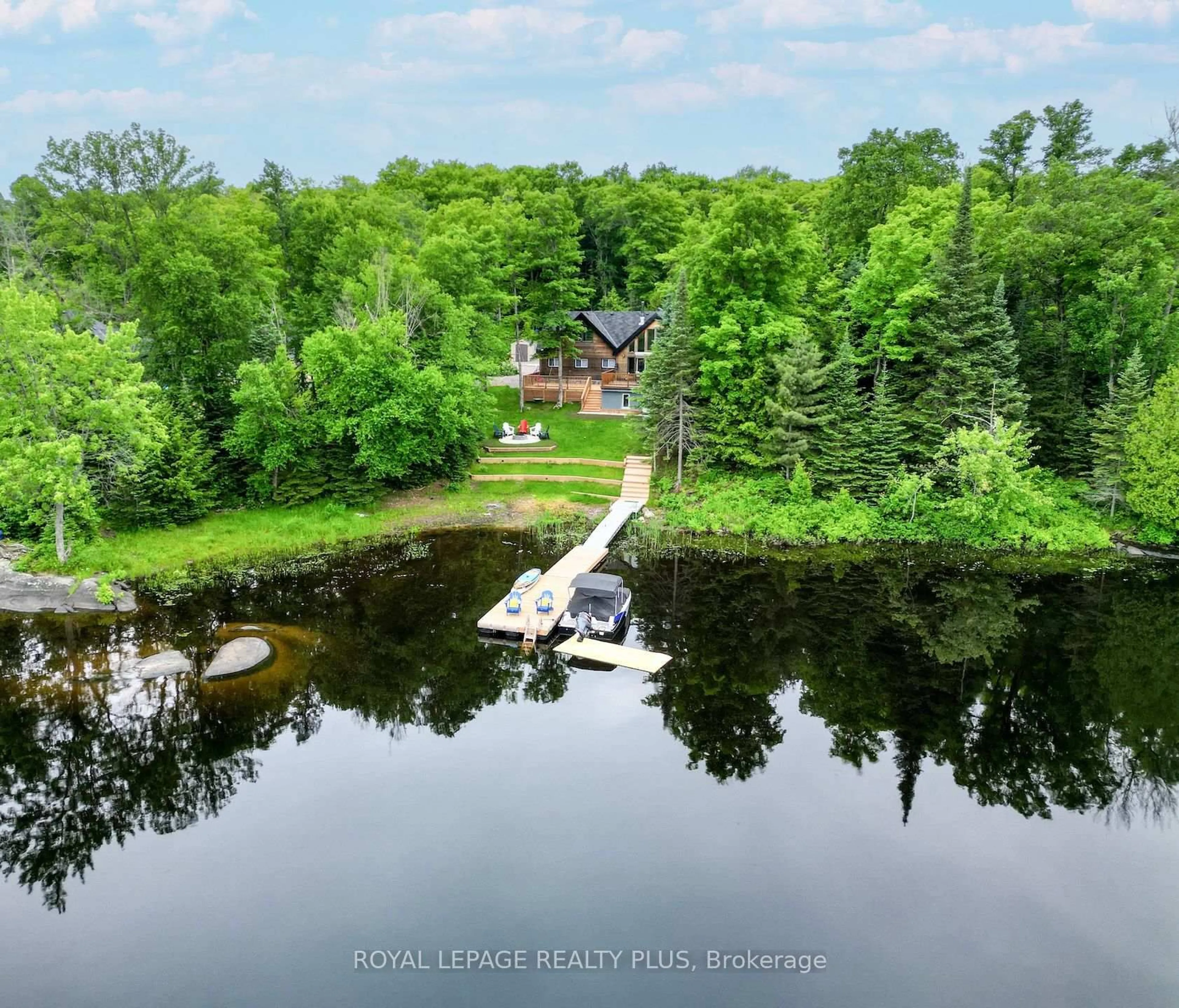 A pic from outside/outdoor area/front of a property/back of a property/a pic from drone, water/lake/river/ocean view for 10 Moose Lane, Whitestone Ontario P0A 1G0