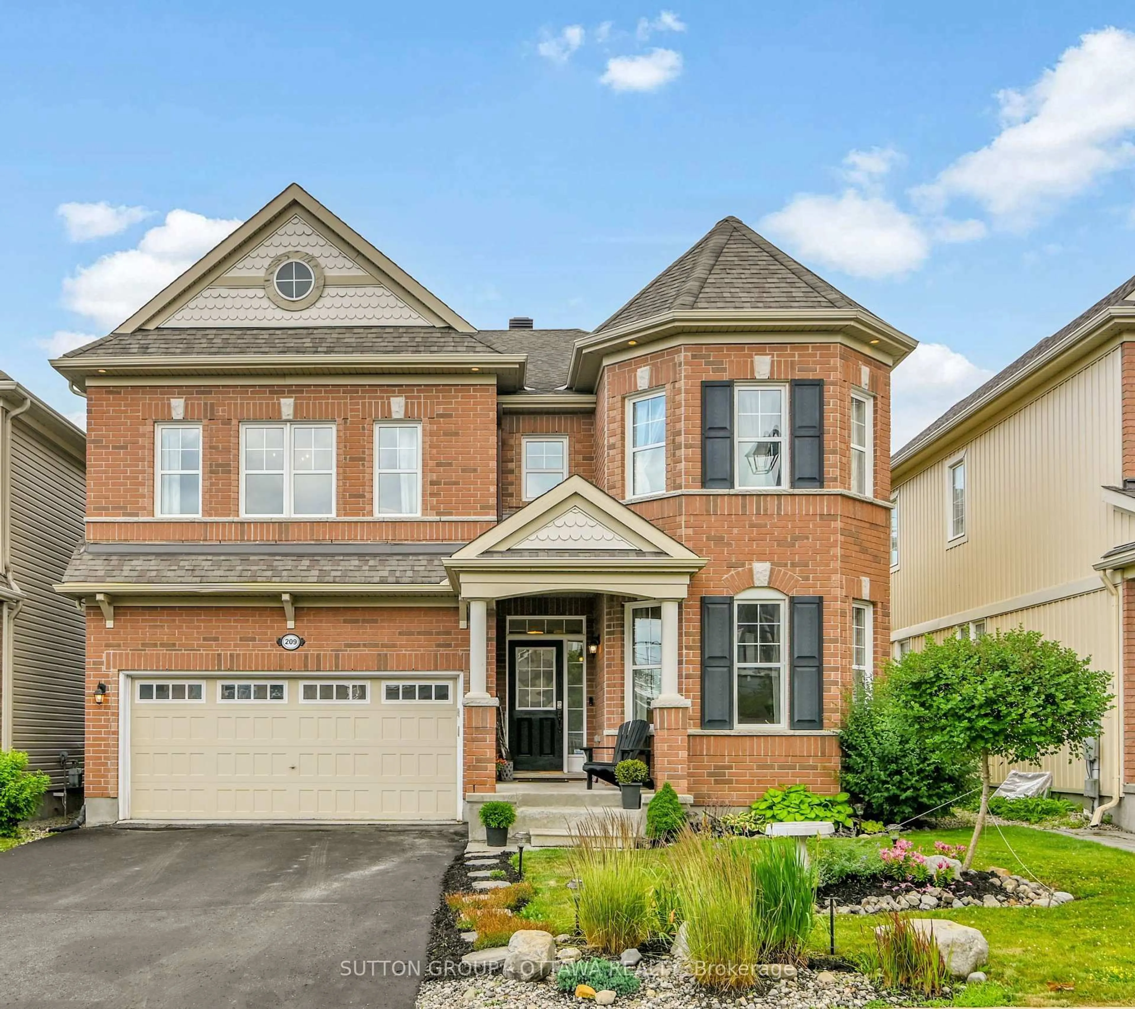 Home with brick exterior material, street for 209 Dutchmans Way, Ottawa Ontario K2J 5W5