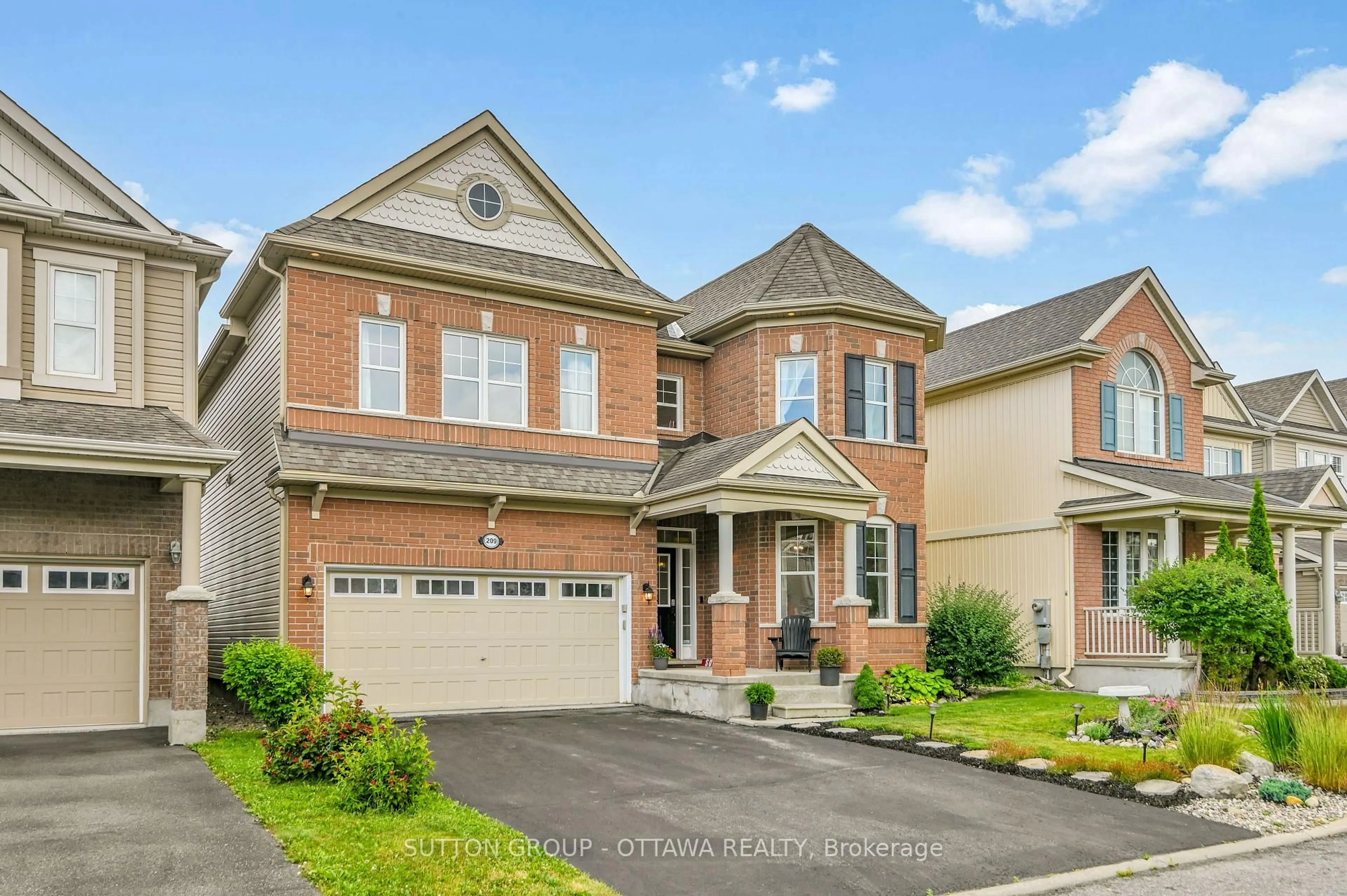 Home with brick exterior material, street for 209 Dutchmans Way, Ottawa Ontario K2J 5W5