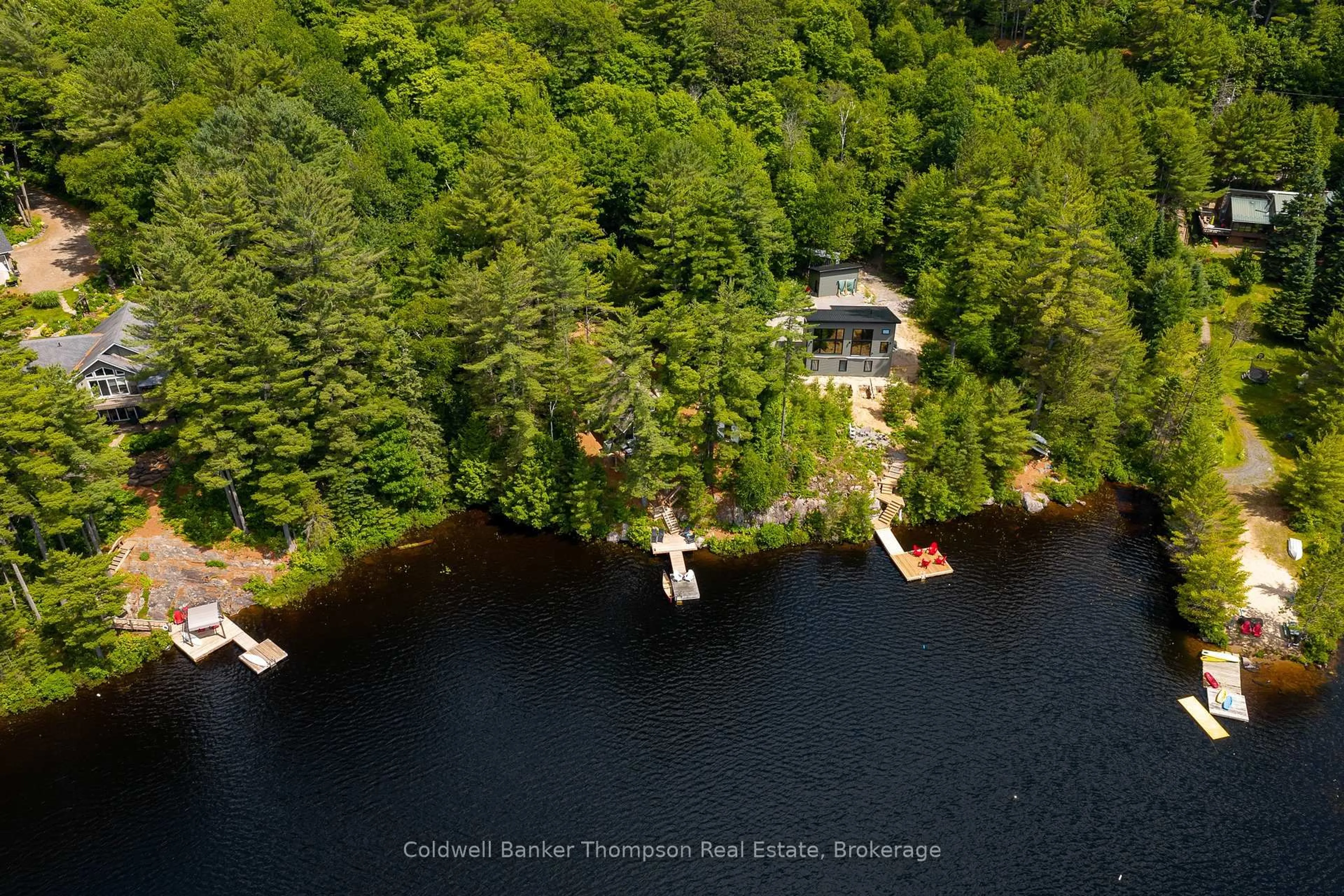 A pic from outside/outdoor area/front of a property/back of a property/a pic from drone, water/lake/river/ocean view for 210 Otter Lake Cottage Rd, Huntsville Ontario P1H 2J3