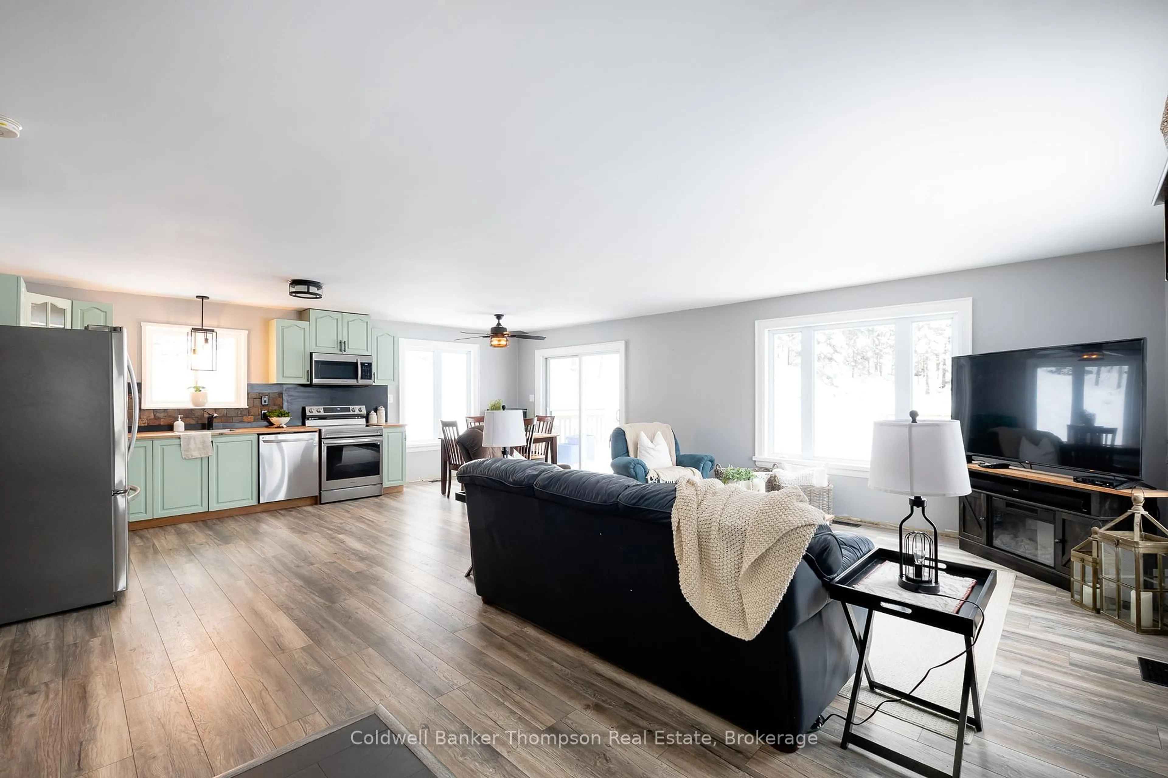 Living room with furniture, wood/laminate floor for 751 Old Muskoka Rd, Huntsville Ontario P0B 1M0