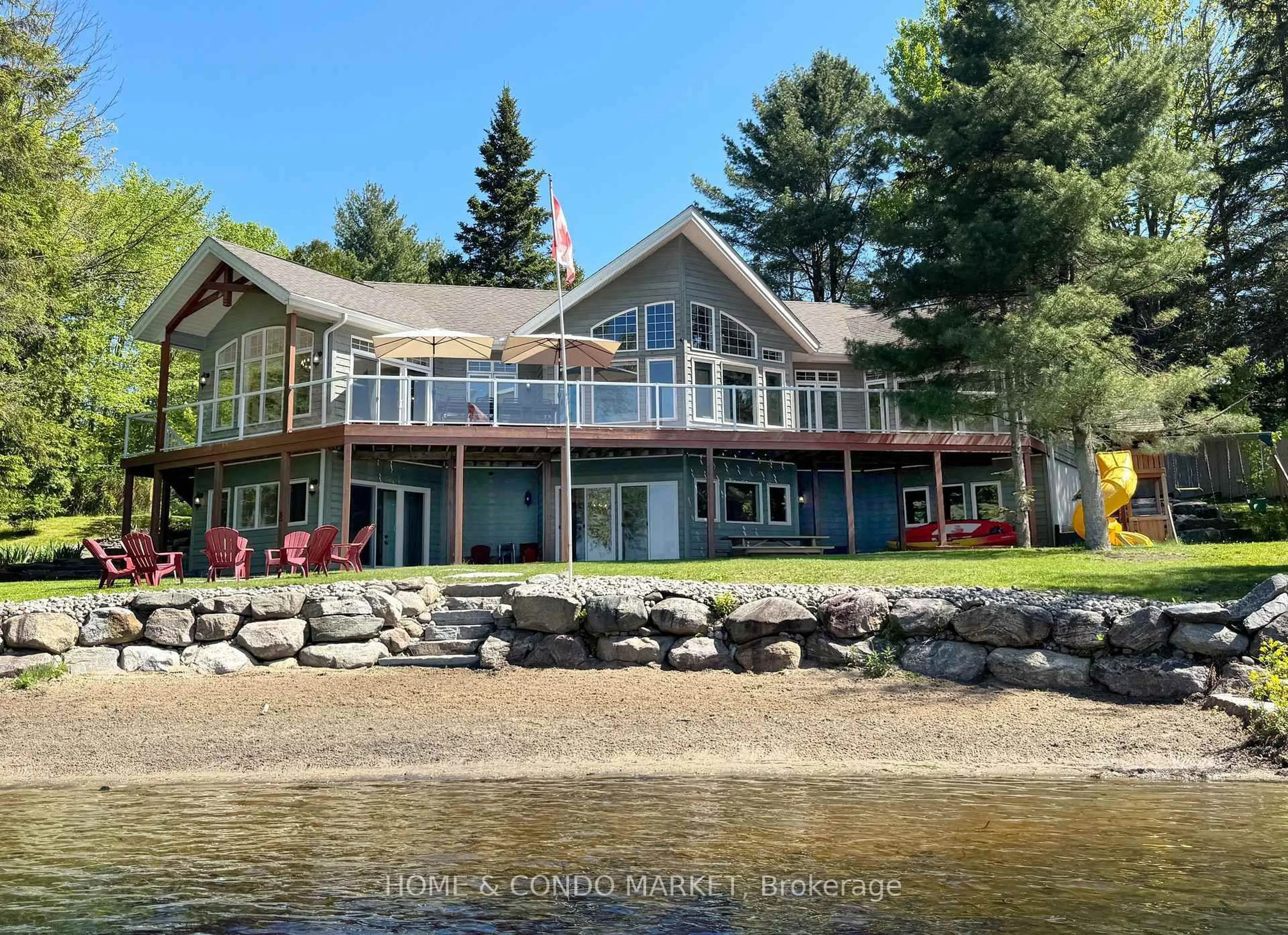 A pic from outside/outdoor area/front of a property/back of a property/a pic from drone, water/lake/river/ocean view for 14 Charles Ave, McKellar Ontario P2A 0B4