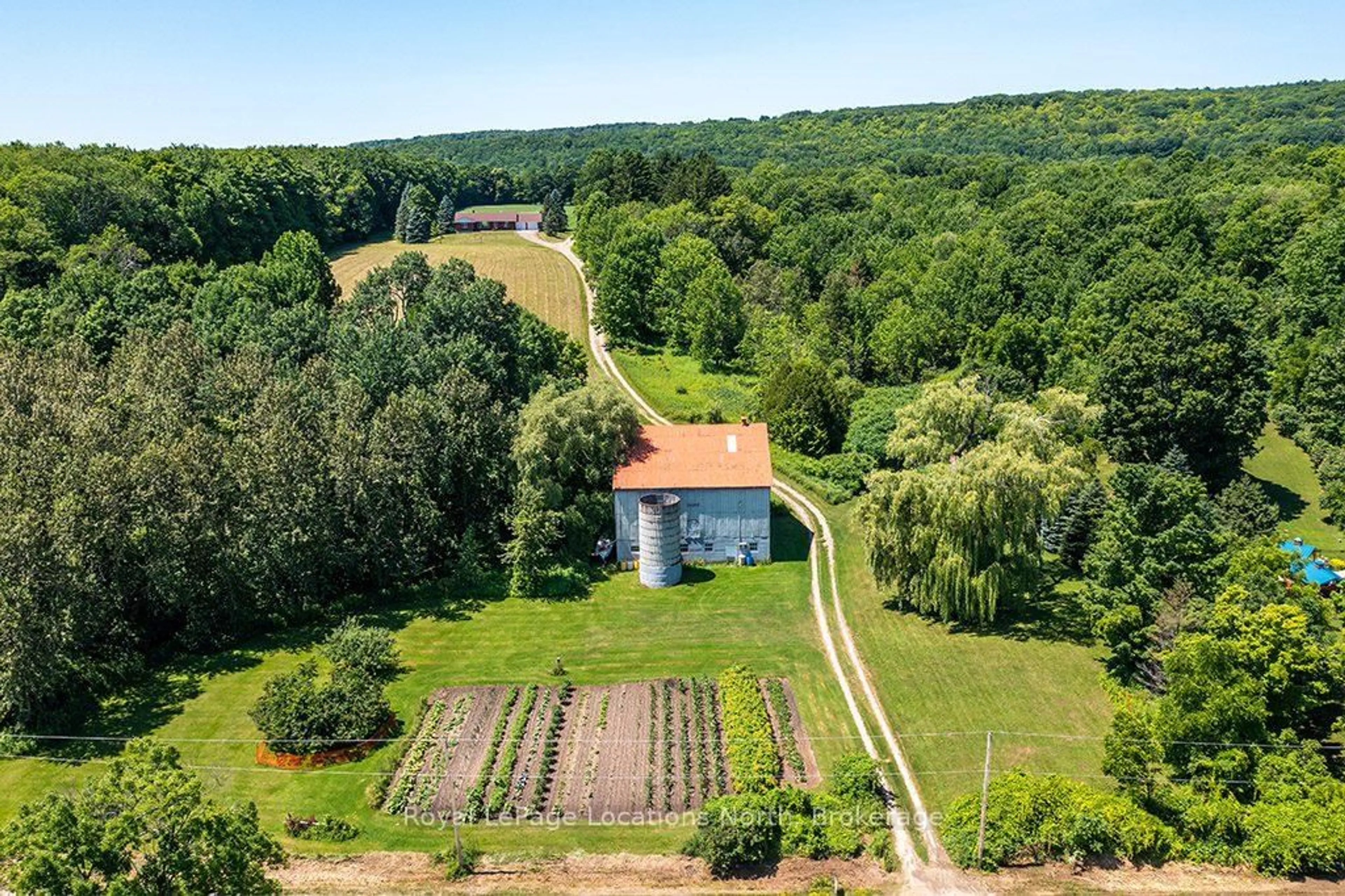 A pic from outside/outdoor area/front of a property/back of a property/a pic from drone, unknown for 159038 7th Line, Meaford Ontario N4L 1W5