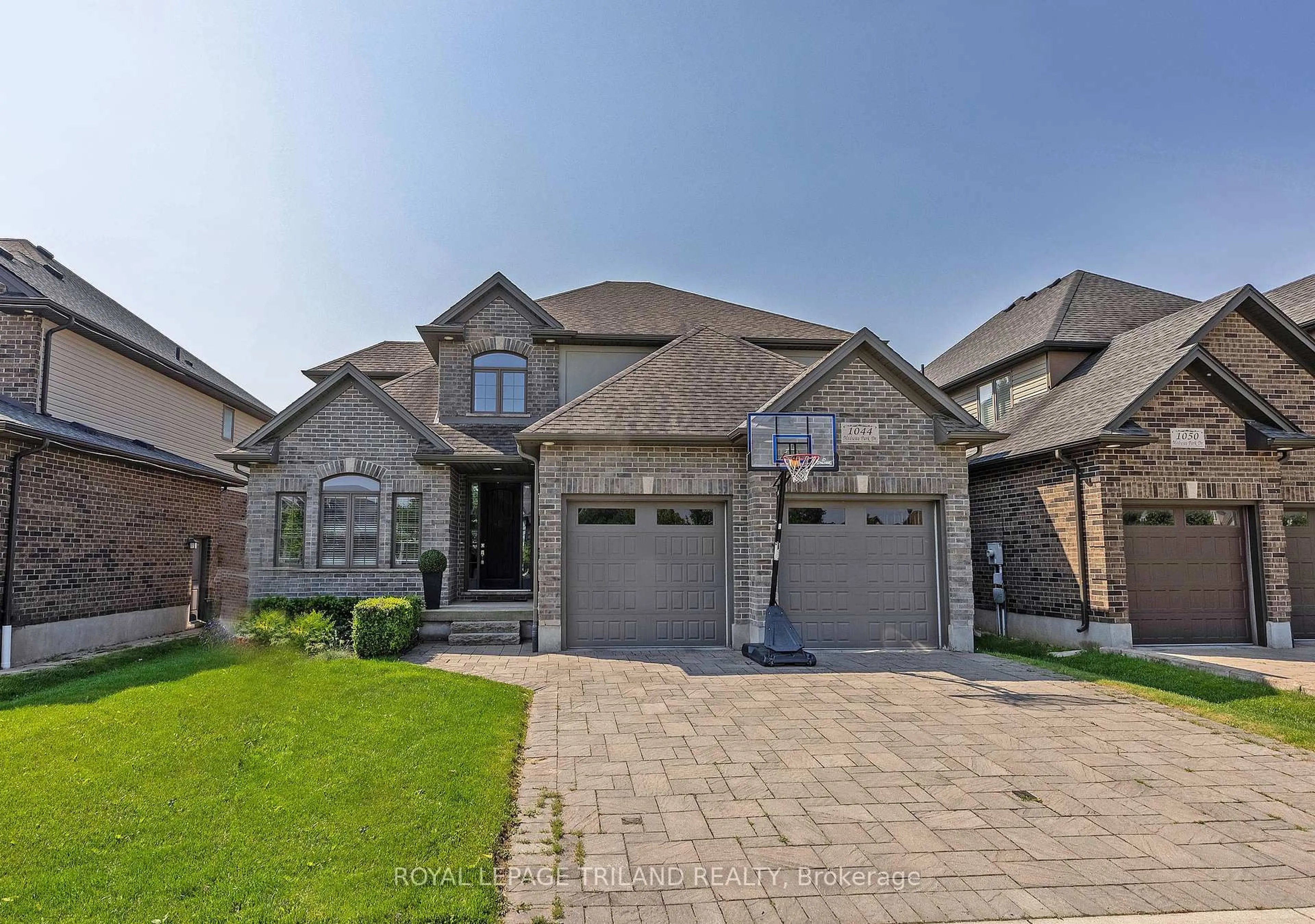 Home with brick exterior material, street for 1044 Medway Park Dr, London North Ontario N6G 0E4