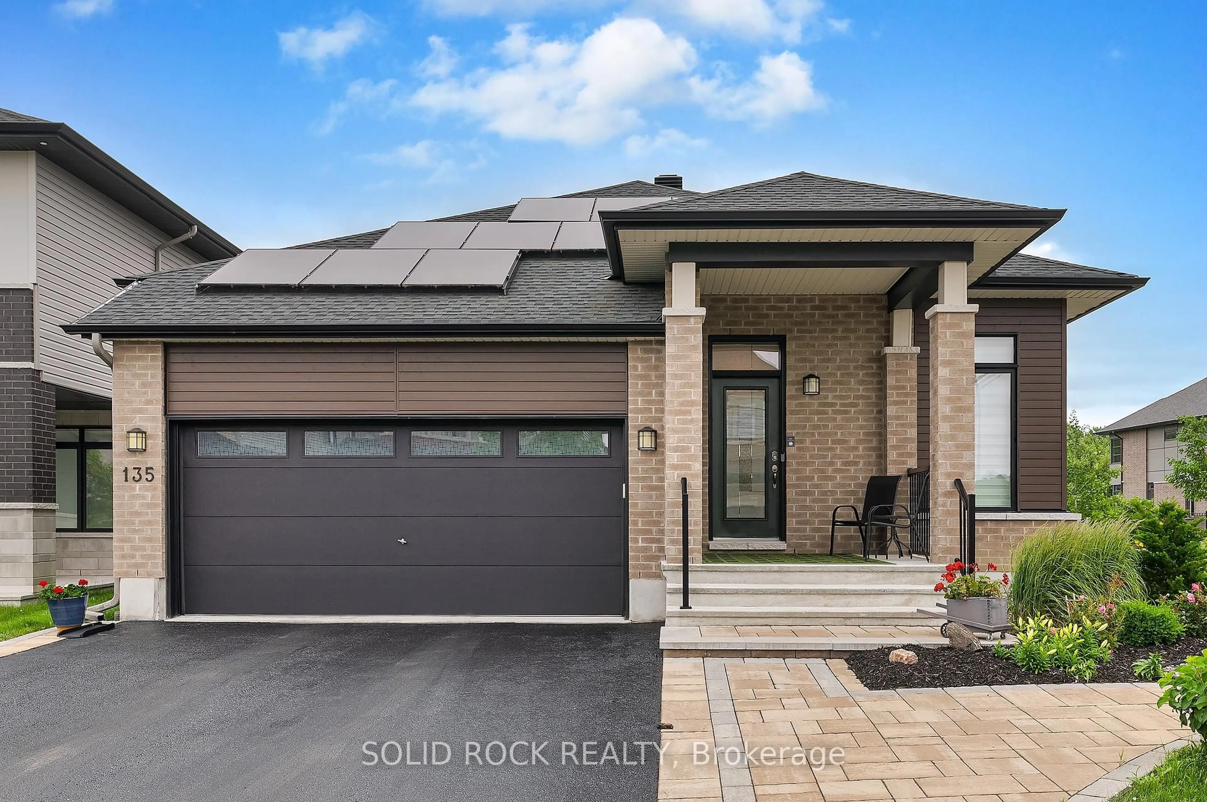 Home with brick exterior material, street for 135 Pathfinder Way, Ottawa Ontario K1X 0C9
