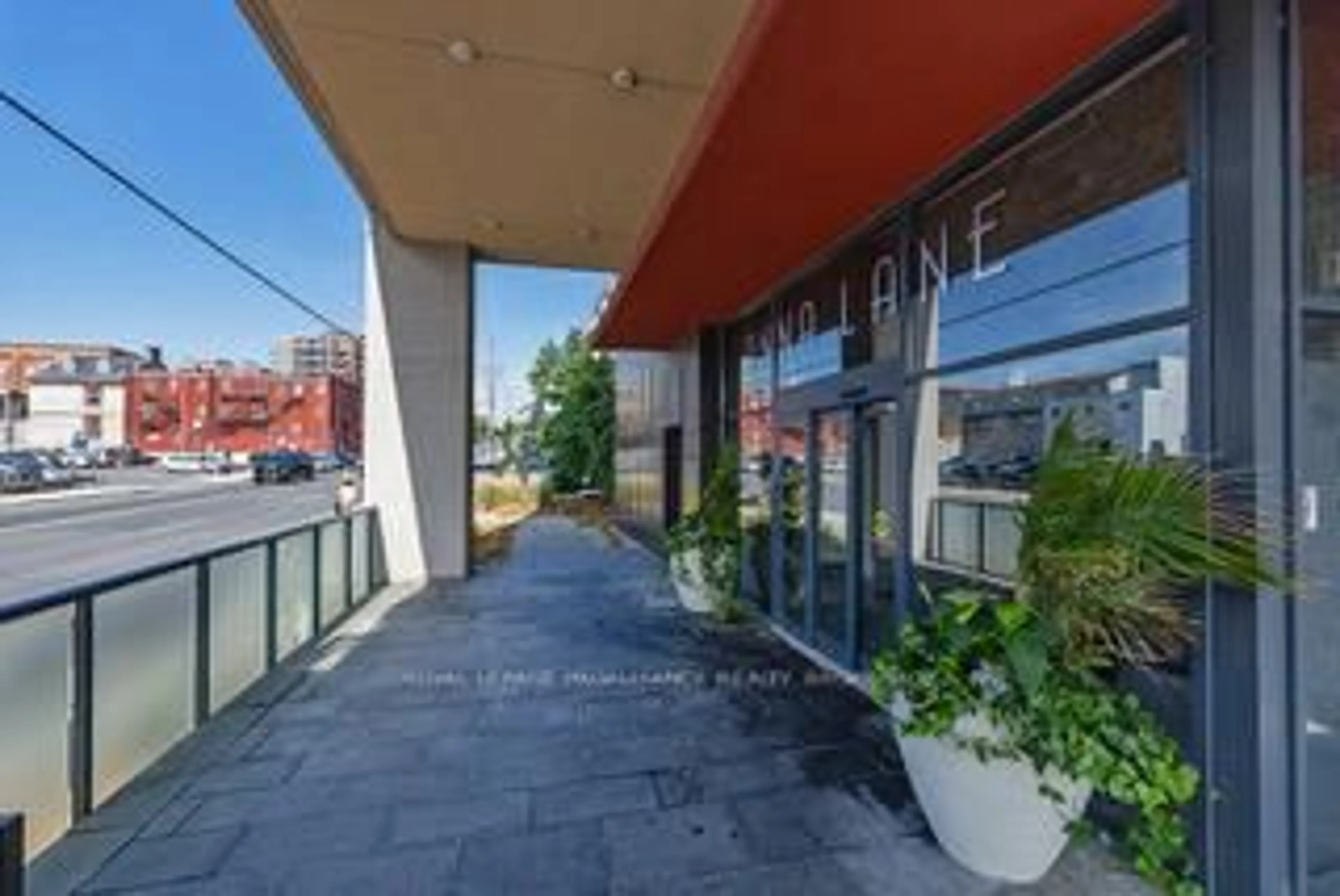 Patio, city buildings view from balcony for 121 Queen St #709, Kingston Ontario K7K 0G6