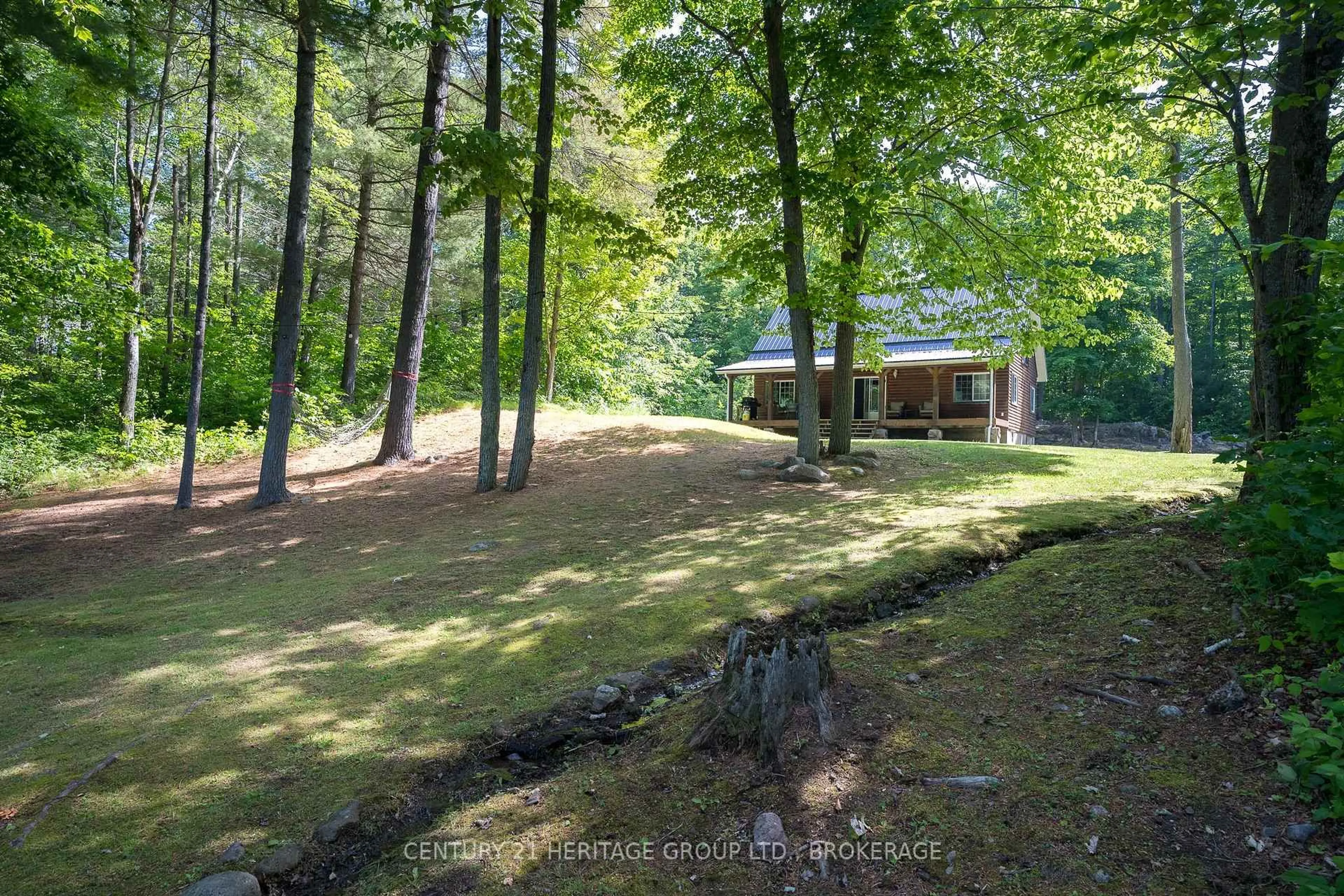A pic from outside/outdoor area/front of a property/back of a property/a pic from drone, forest/trees view for 1147 Ducharme Rd, Sharbot Lake Ontario K0H 2P0