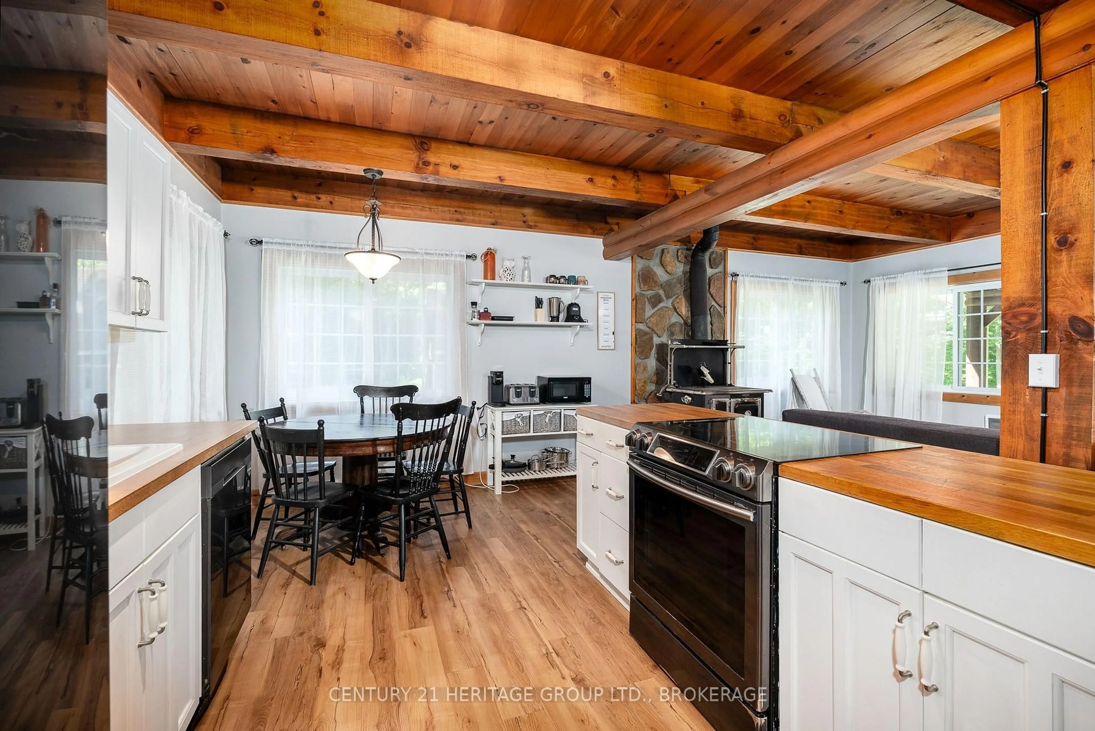 Open concept kitchen, wood/laminate floor for 1147 Ducharme Rd, Sharbot Lake Ontario K0H 2P0