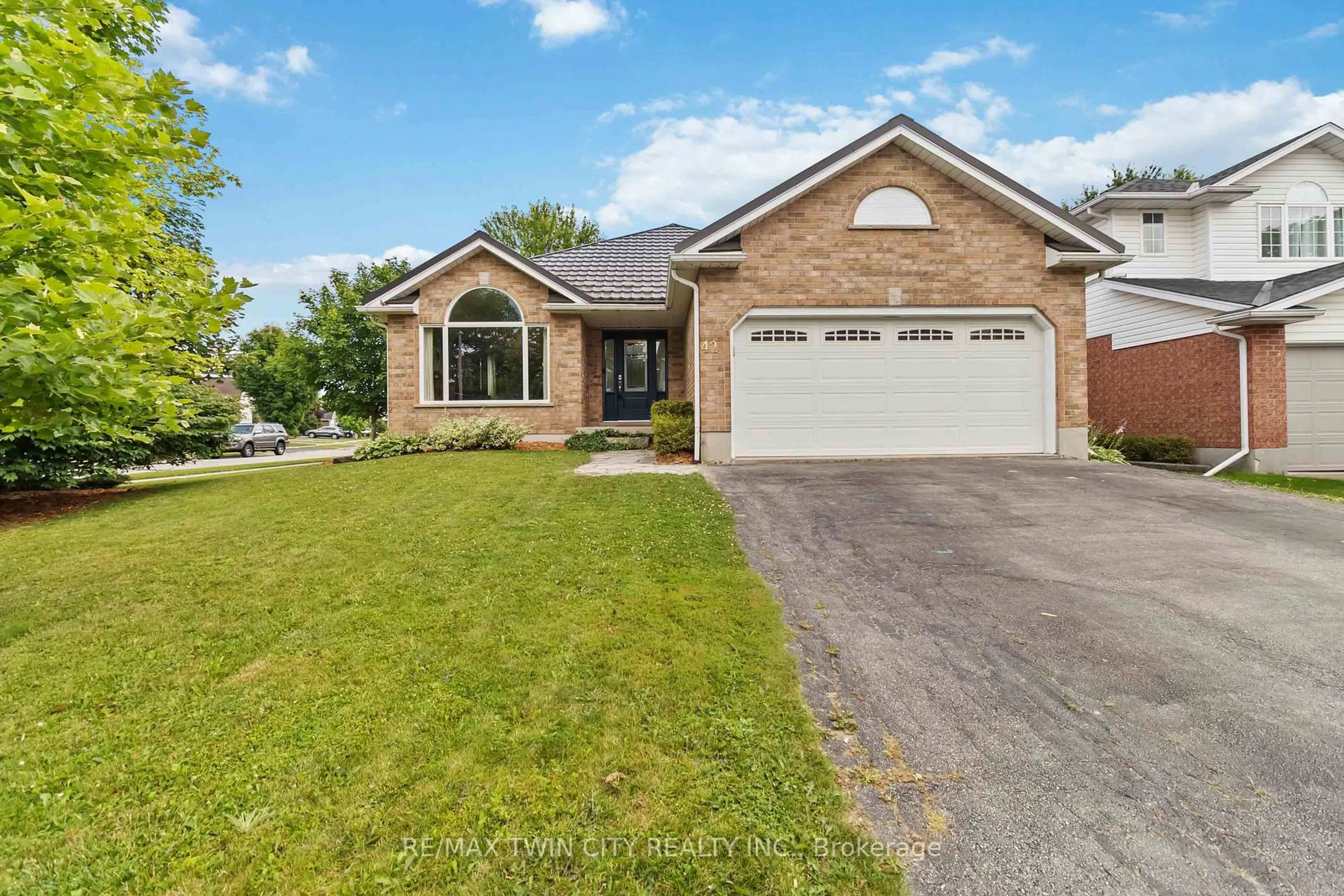 Home with brick exterior material, street for 42 Sandpiper Dr, Guelph Ontario N1C 1C9