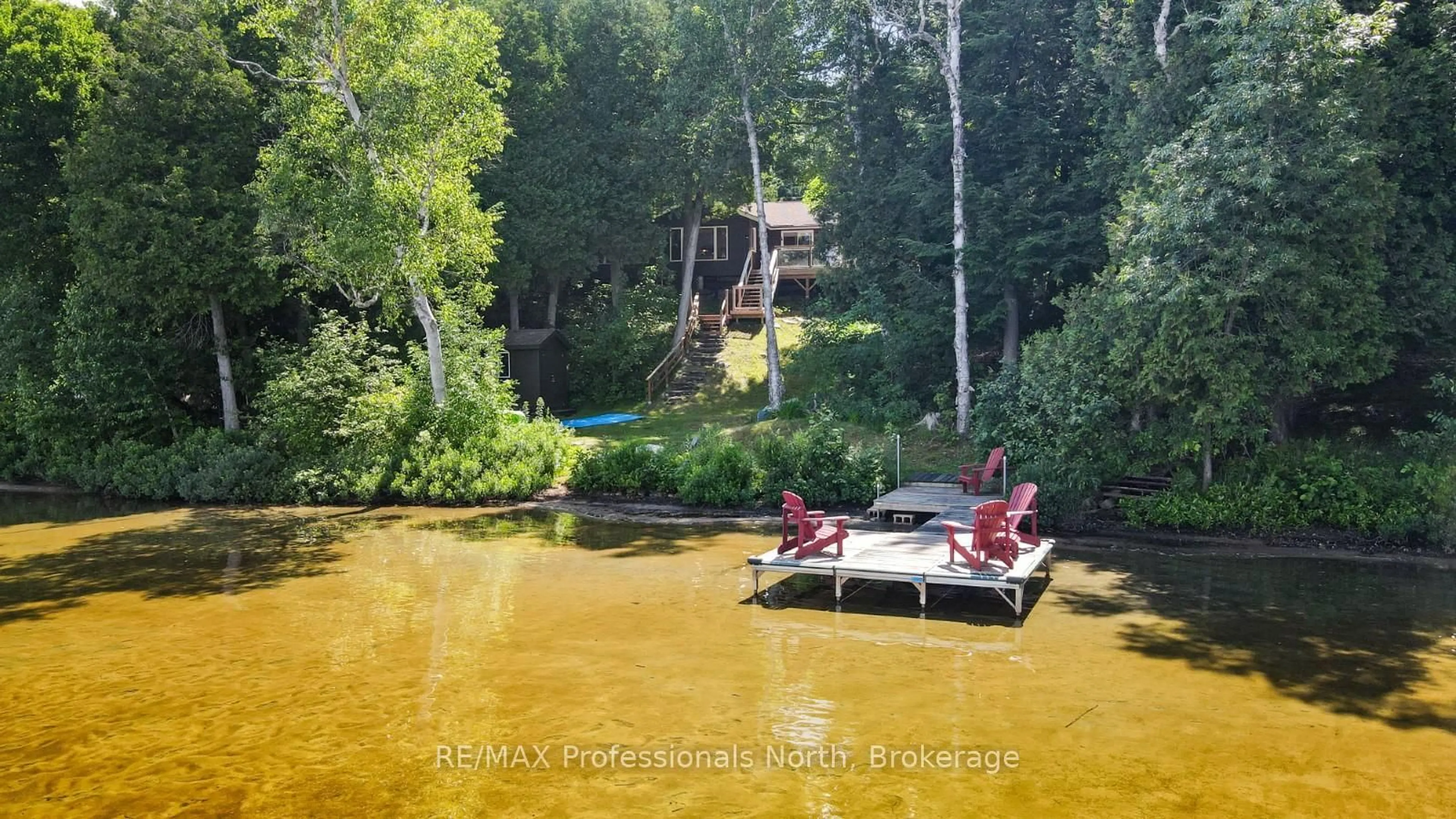 A pic from outside/outdoor area/front of a property/back of a property/a pic from drone, water/lake/river/ocean view for 1144 Fry Lane, Algonquin Highlands Ontario K0M 1S0