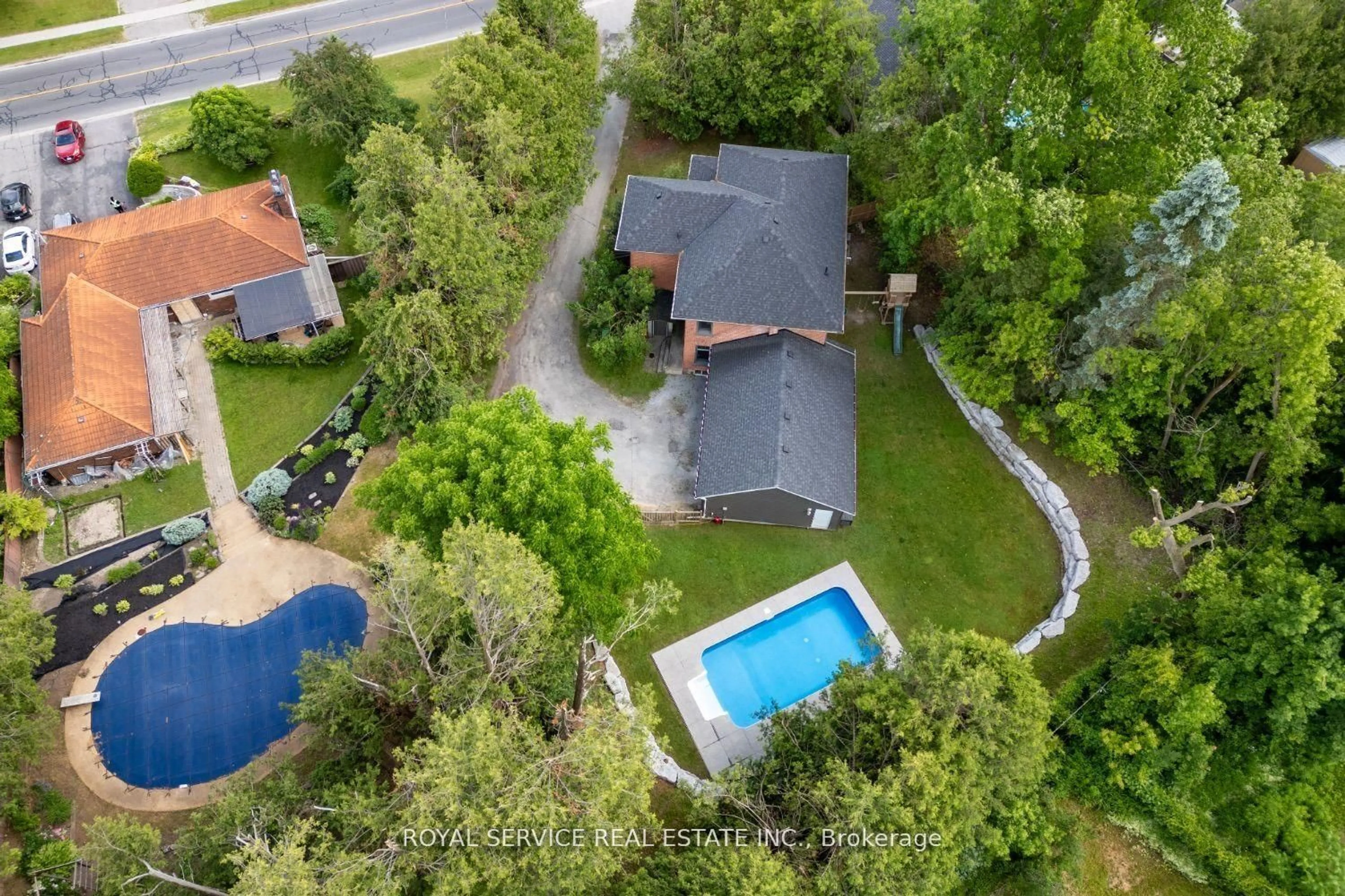 A pic from outside/outdoor area/front of a property/back of a property/a pic from drone, street for 47 Kawartha Heights Blvd, Peterborough West Ontario K9J 1N5
