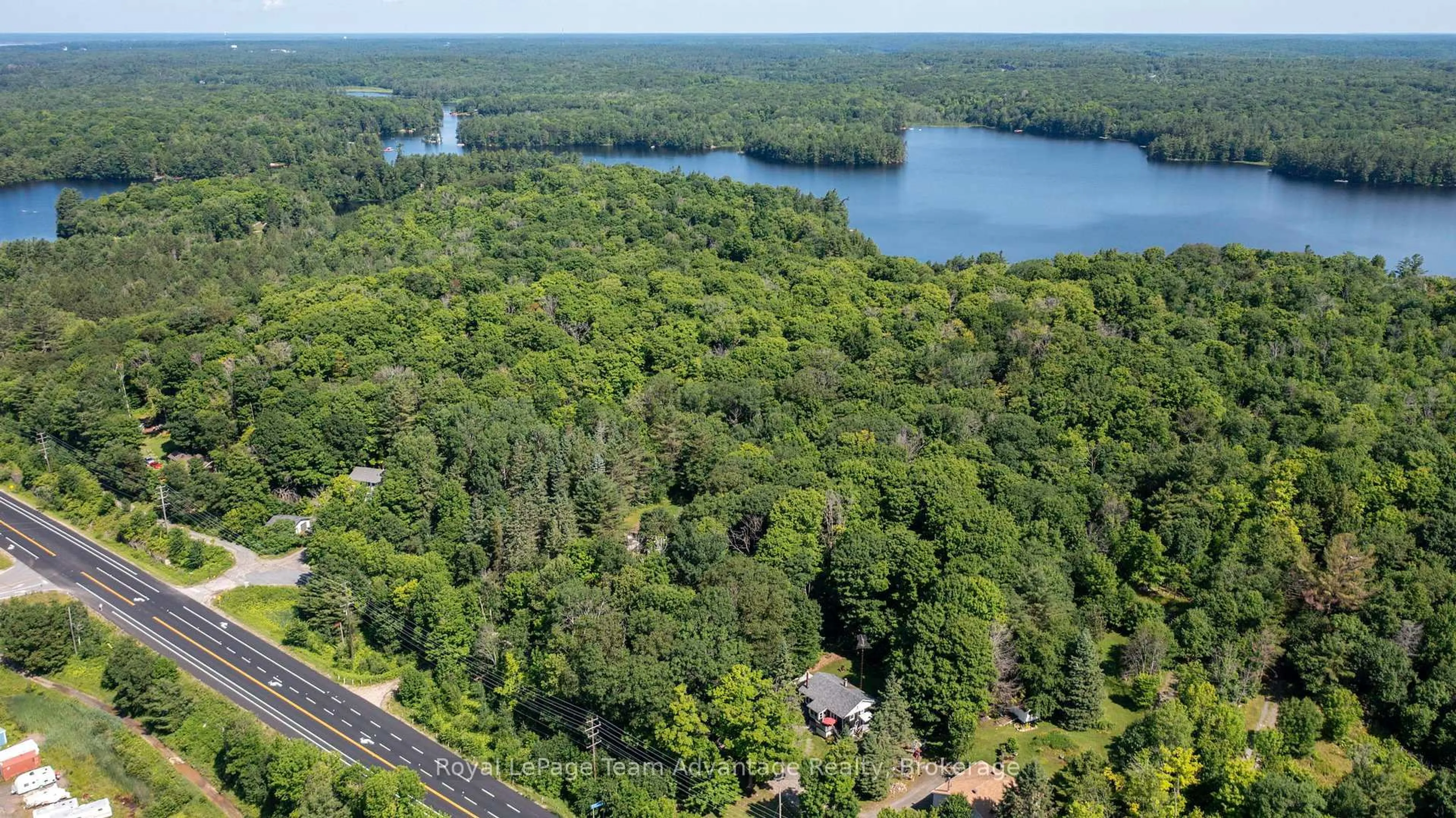 A pic from outside/outdoor area/front of a property/back of a property/a pic from drone, water/lake/river/ocean view for 9 Woods Lane, Seguin Ontario P2A 2W8