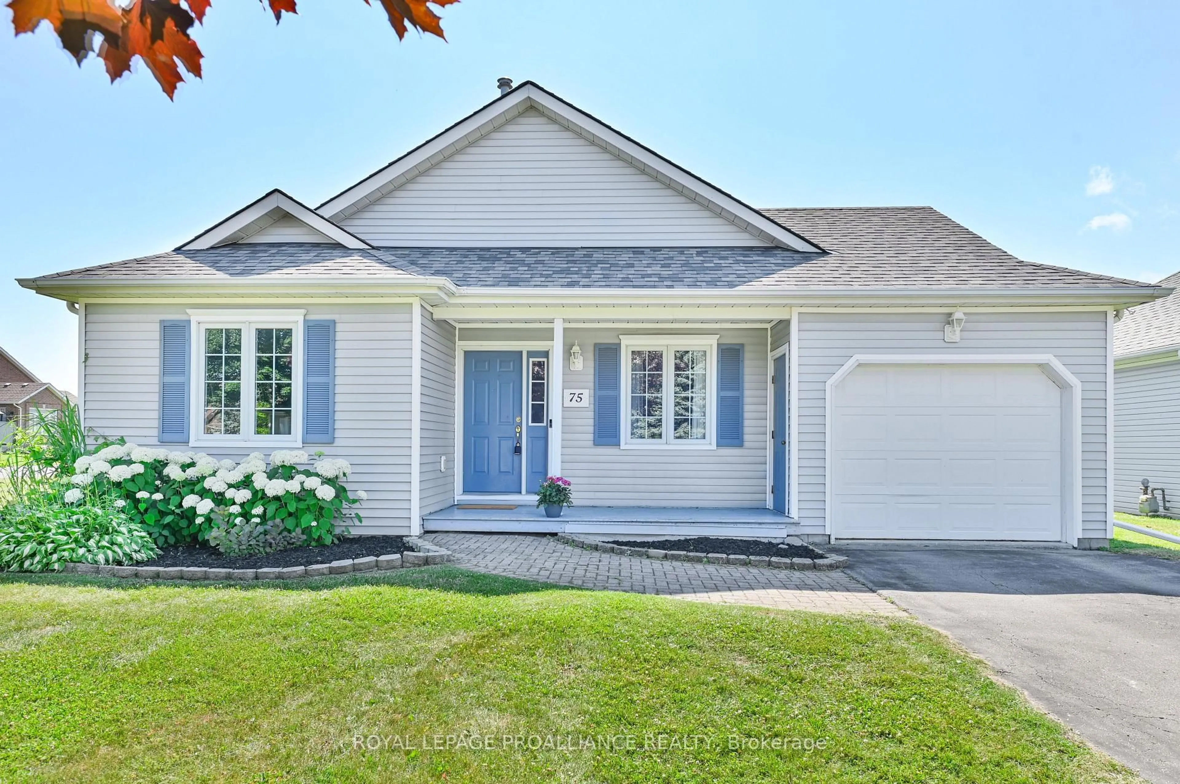 Home with vinyl exterior material, street for 75 Mills Rd, Brighton Ontario K0K 1H0
