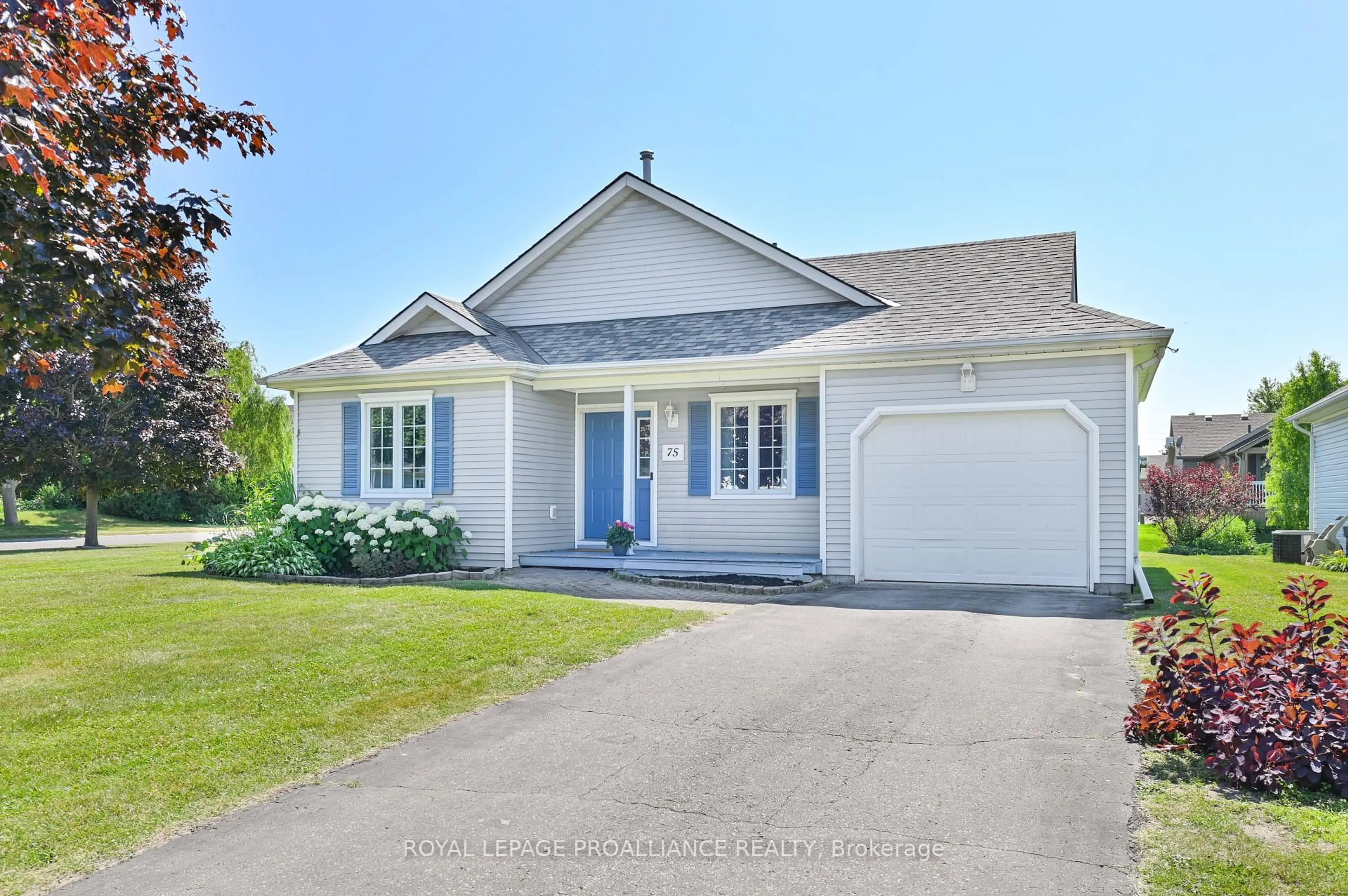 Home with vinyl exterior material, street for 75 Mills Rd, Brighton Ontario K0K 1H0