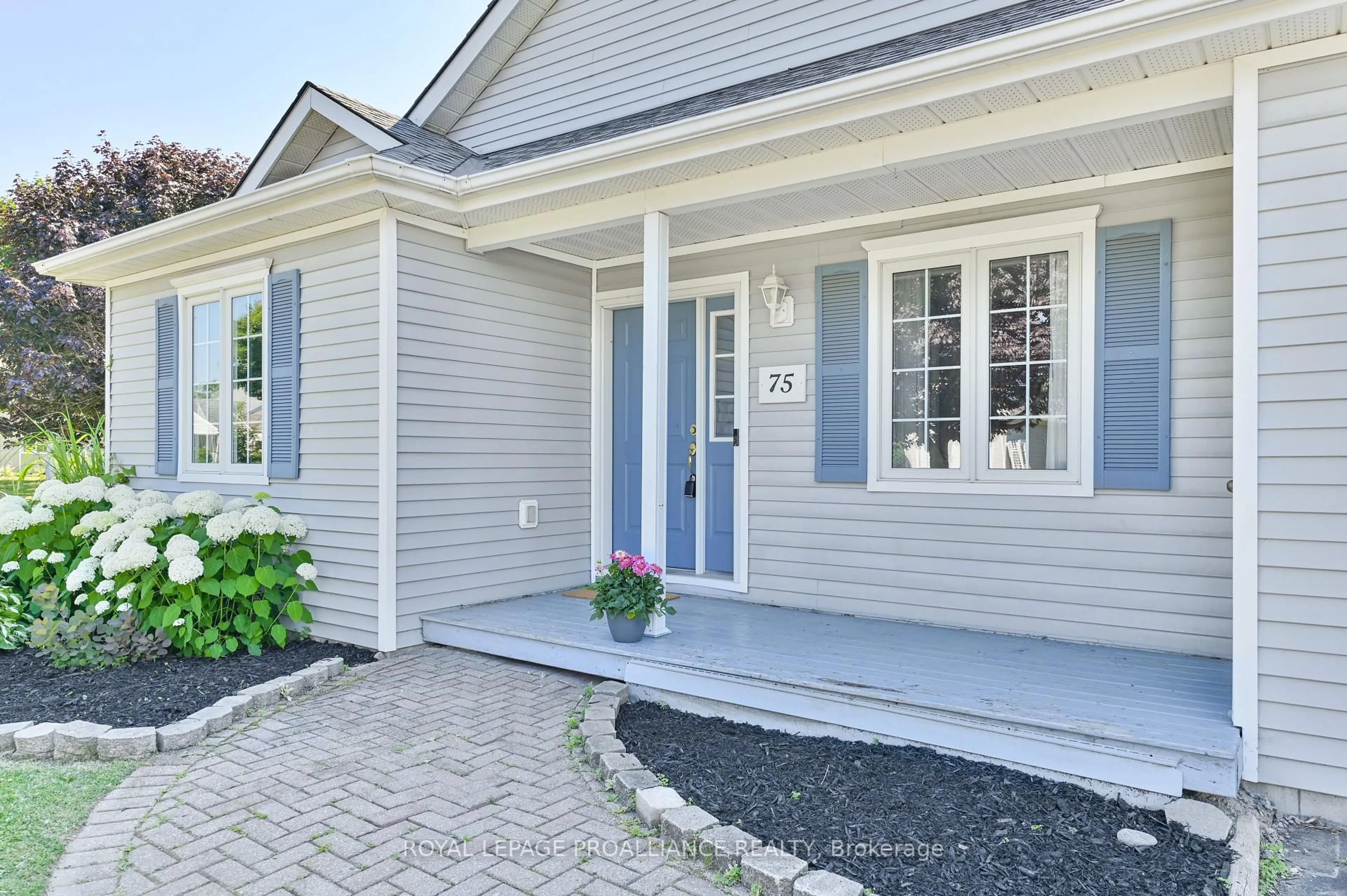 Home with vinyl exterior material, street for 75 Mills Rd, Brighton Ontario K0K 1H0