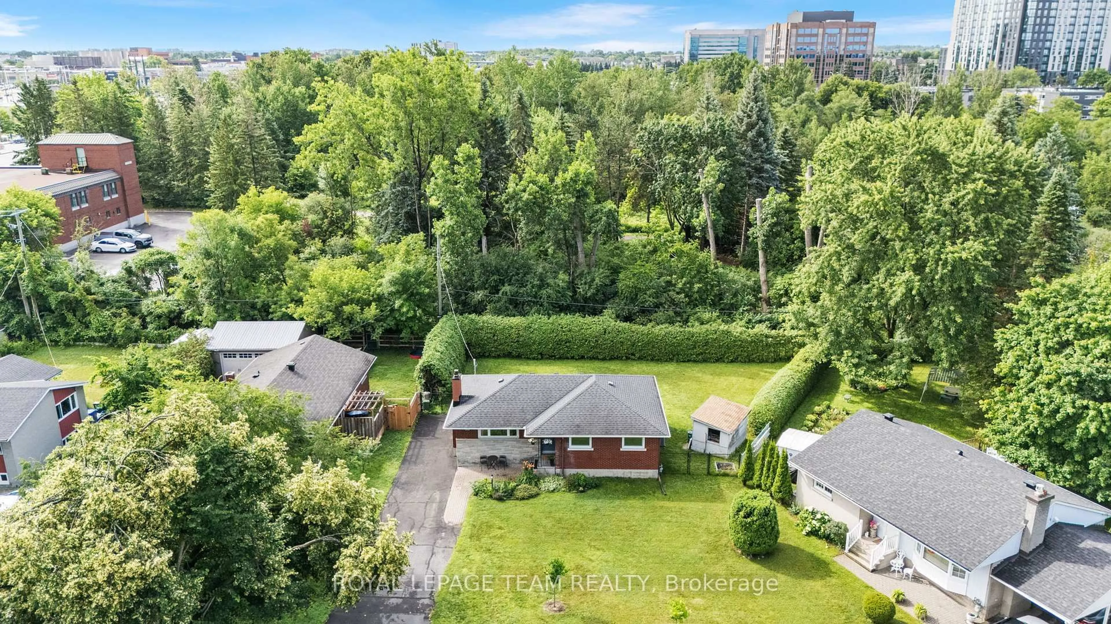 A pic from outside/outdoor area/front of a property/back of a property/a pic from drone, forest/trees view for 1300 Adirondack Dr, Ottawa Ontario K2C 2V3