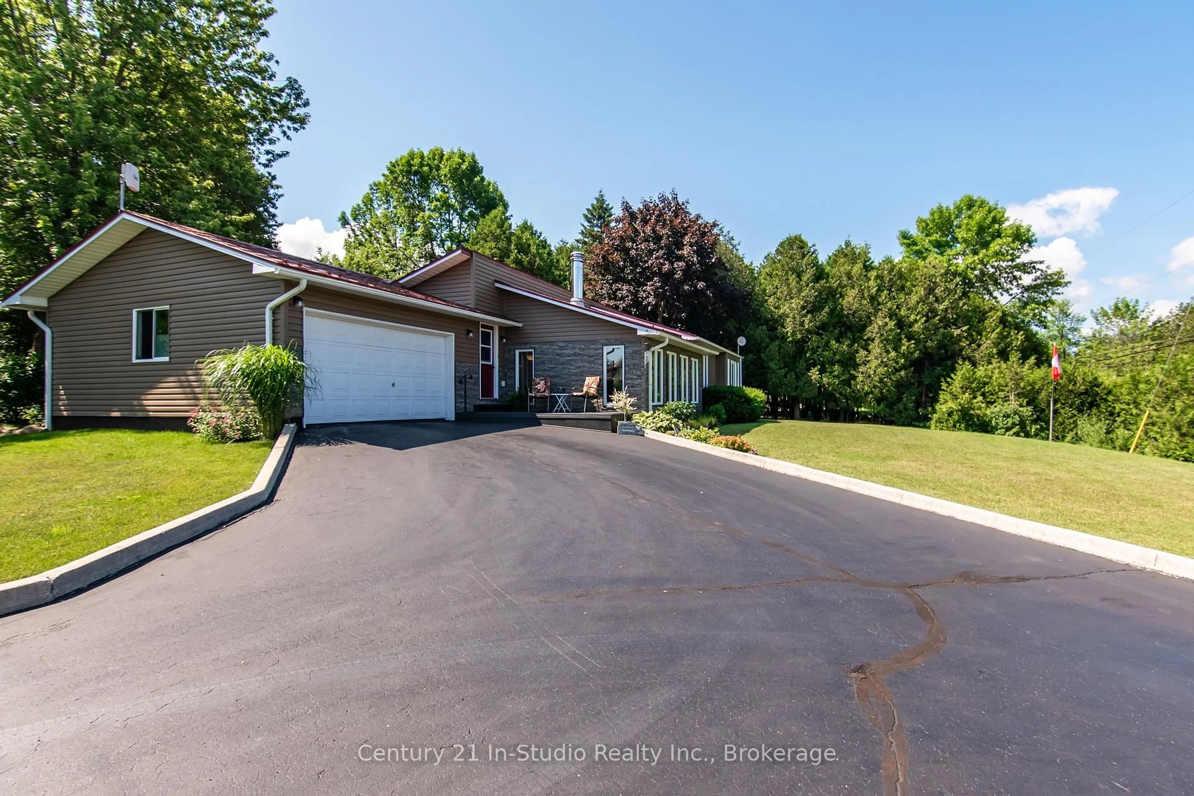 A pic from outside/outdoor area/front of a property/back of a property/a pic from drone, street for 502230 Grey Road 1 Rd, Georgian Bluffs Ontario N0H 2T0