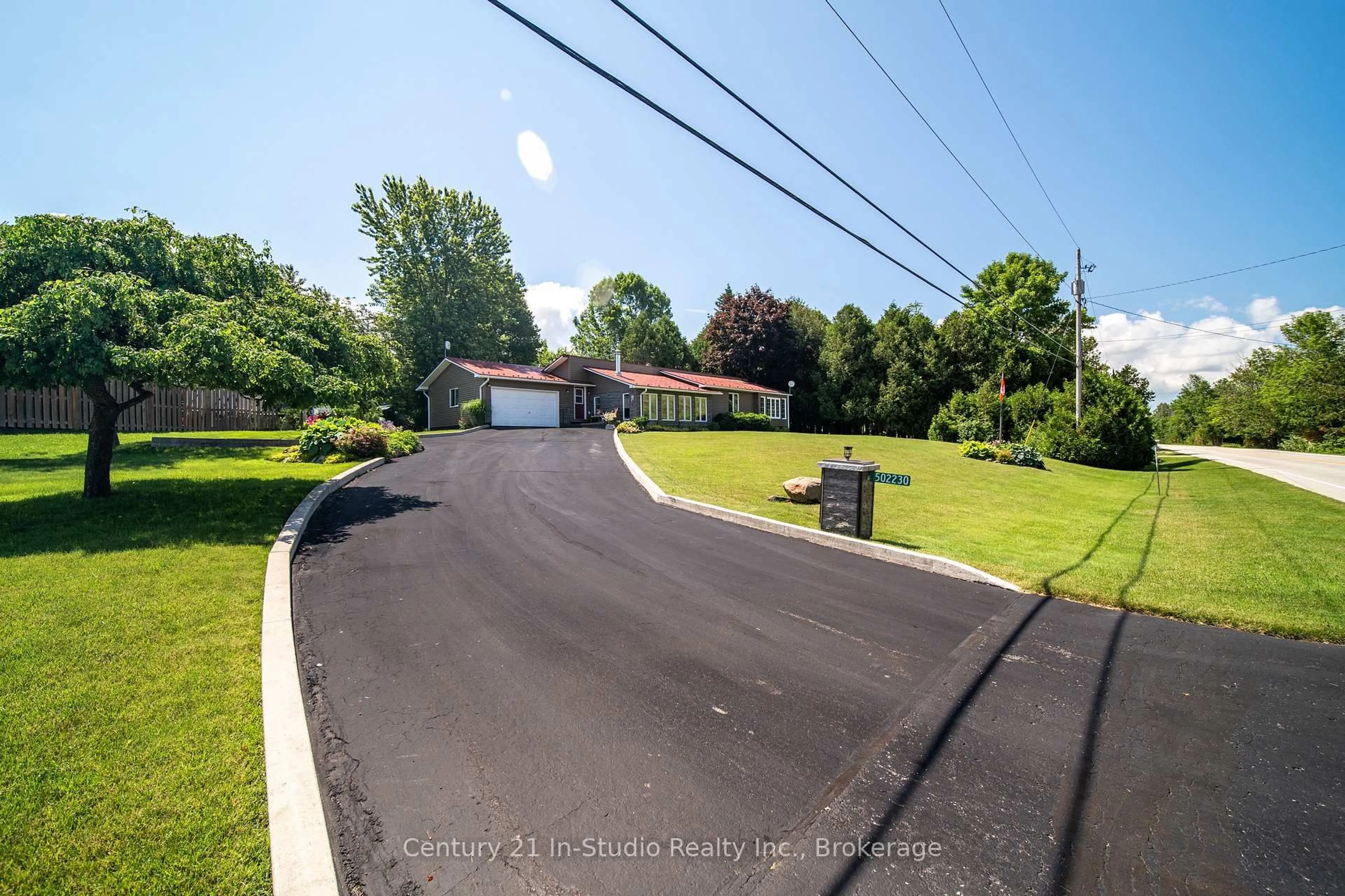 A pic from outside/outdoor area/front of a property/back of a property/a pic from drone, street for 502230 Grey Road 1 Rd, Georgian Bluffs Ontario N0H 2T0