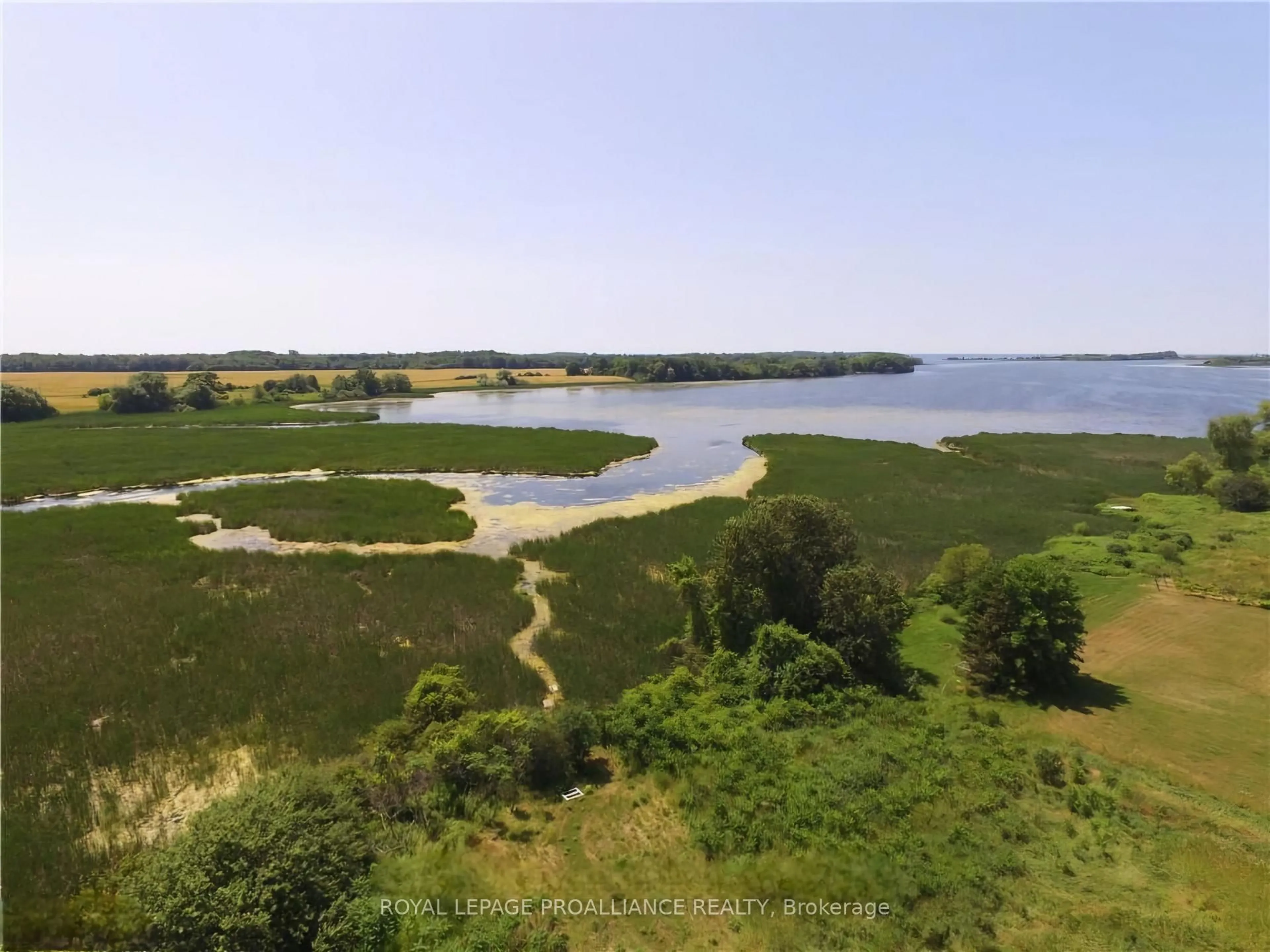 A pic from outside/outdoor area/front of a property/back of a property/a pic from drone, water/lake/river/ocean view for 19185 LOYALIST Pkwy, Prince Edward County Ontario K0K 1T0