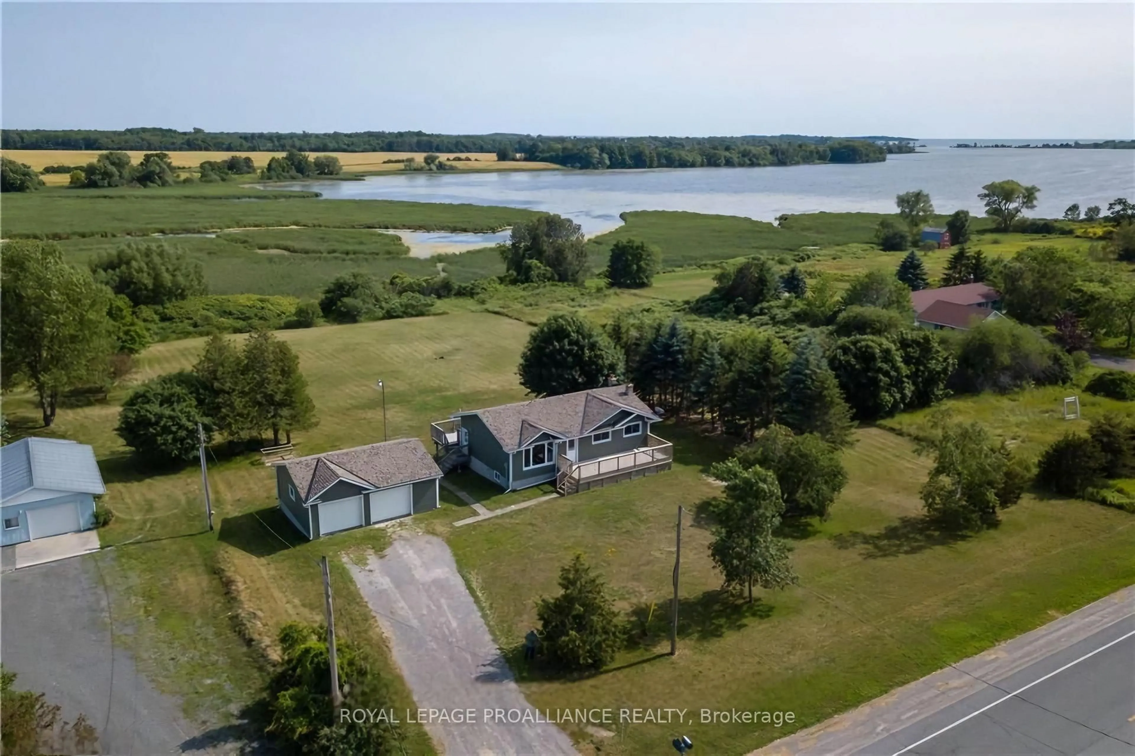 A pic from outside/outdoor area/front of a property/back of a property/a pic from drone, water/lake/river/ocean view for 19185 LOYALIST Pkwy, Prince Edward County Ontario K0K 1T0
