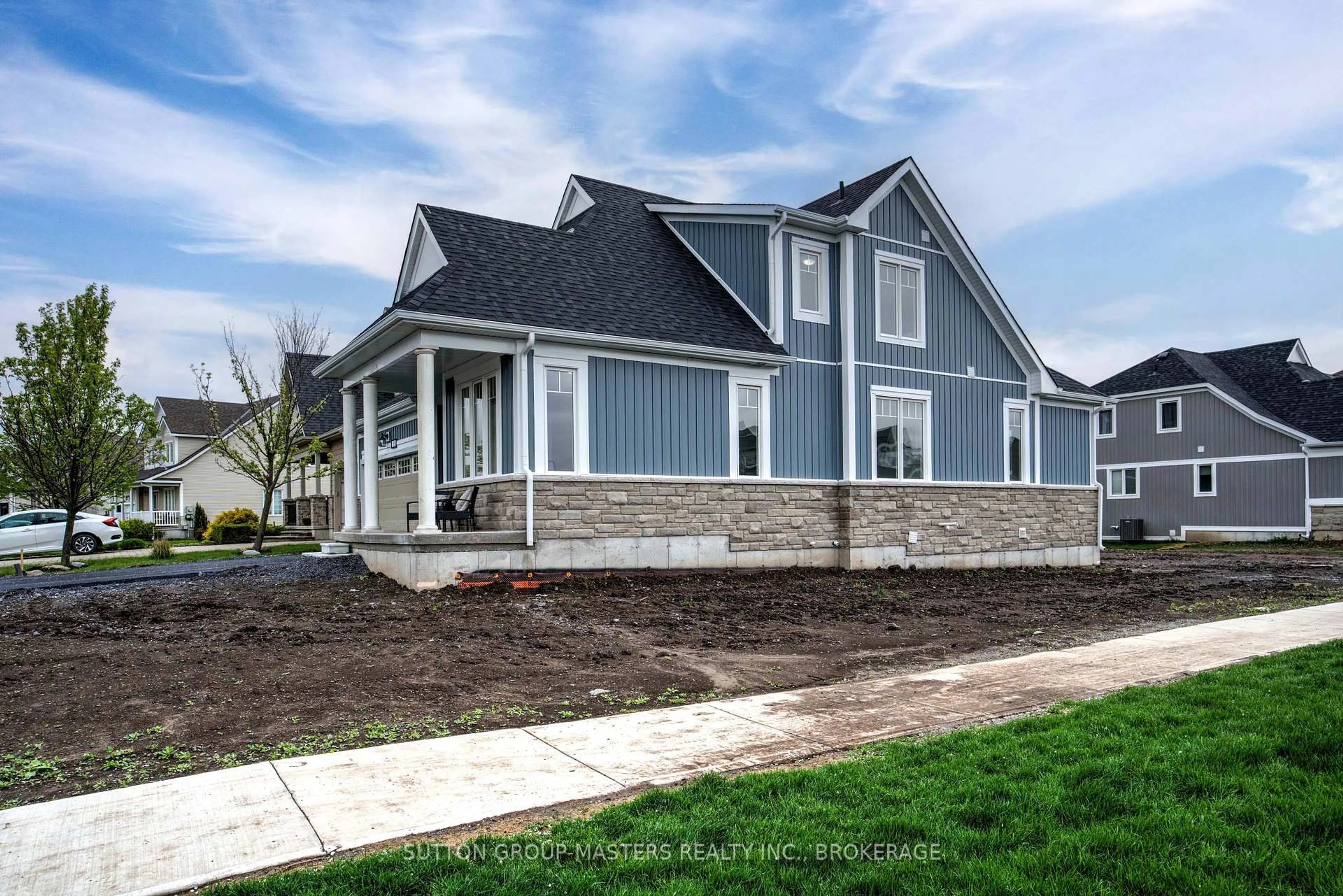 Home with vinyl exterior material, street for 35 Country Club Dr, Bath Ontario K0H 1G0