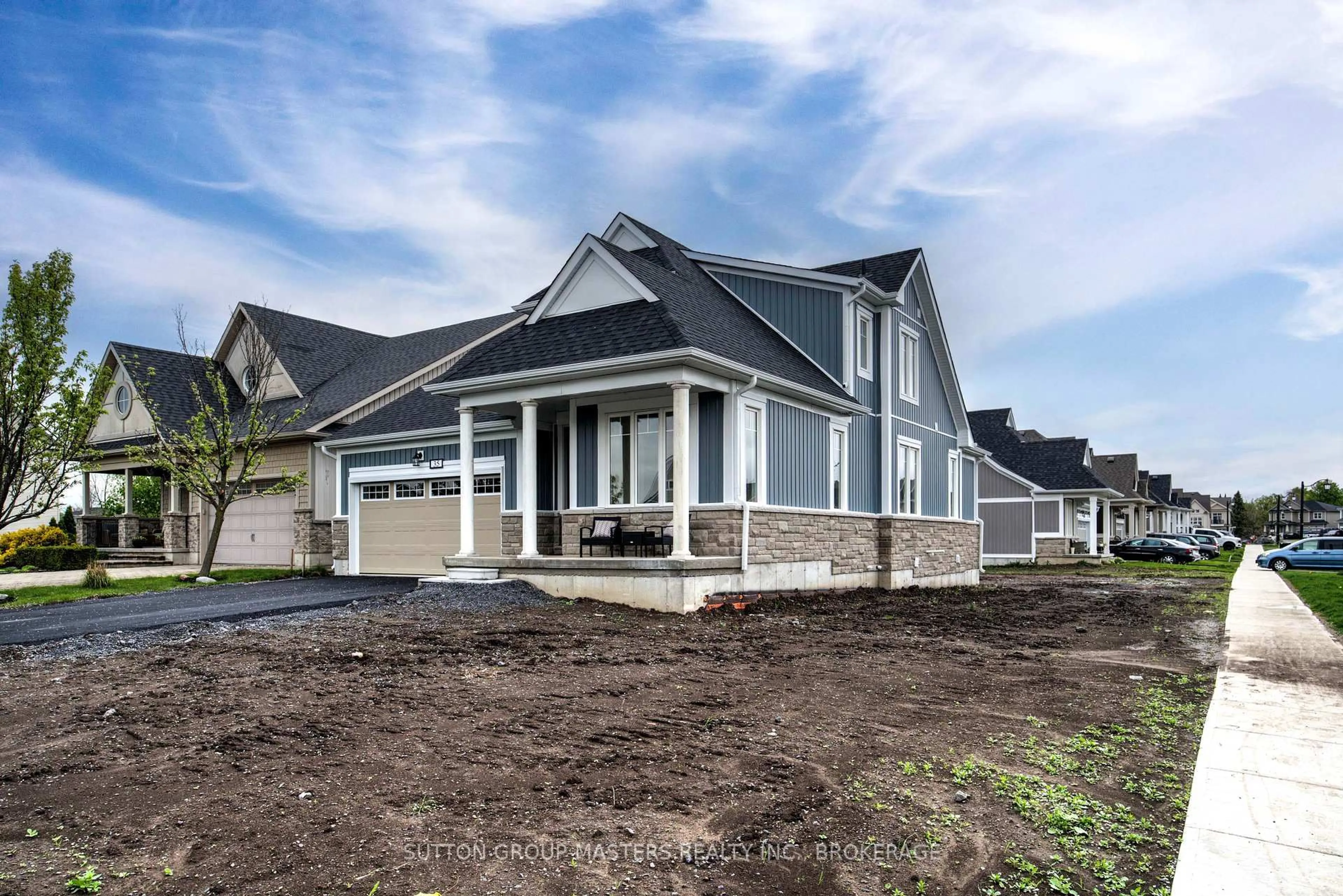 Home with vinyl exterior material, street for 35 Country Club Dr, Bath Ontario K0H 1G0