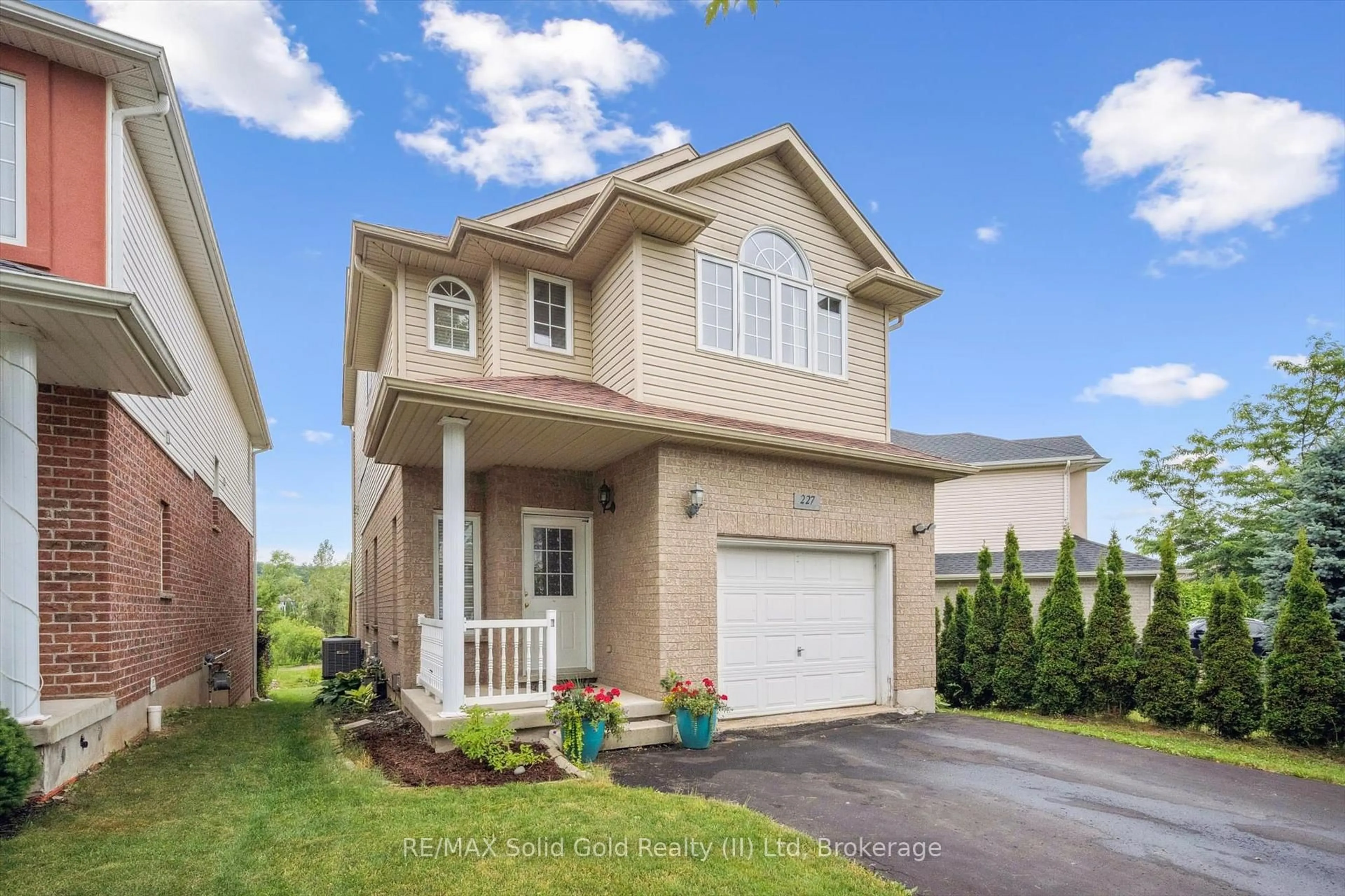 Home with vinyl exterior material, street for 227 Buttercup Crt, Waterloo Ontario N2V 2W8