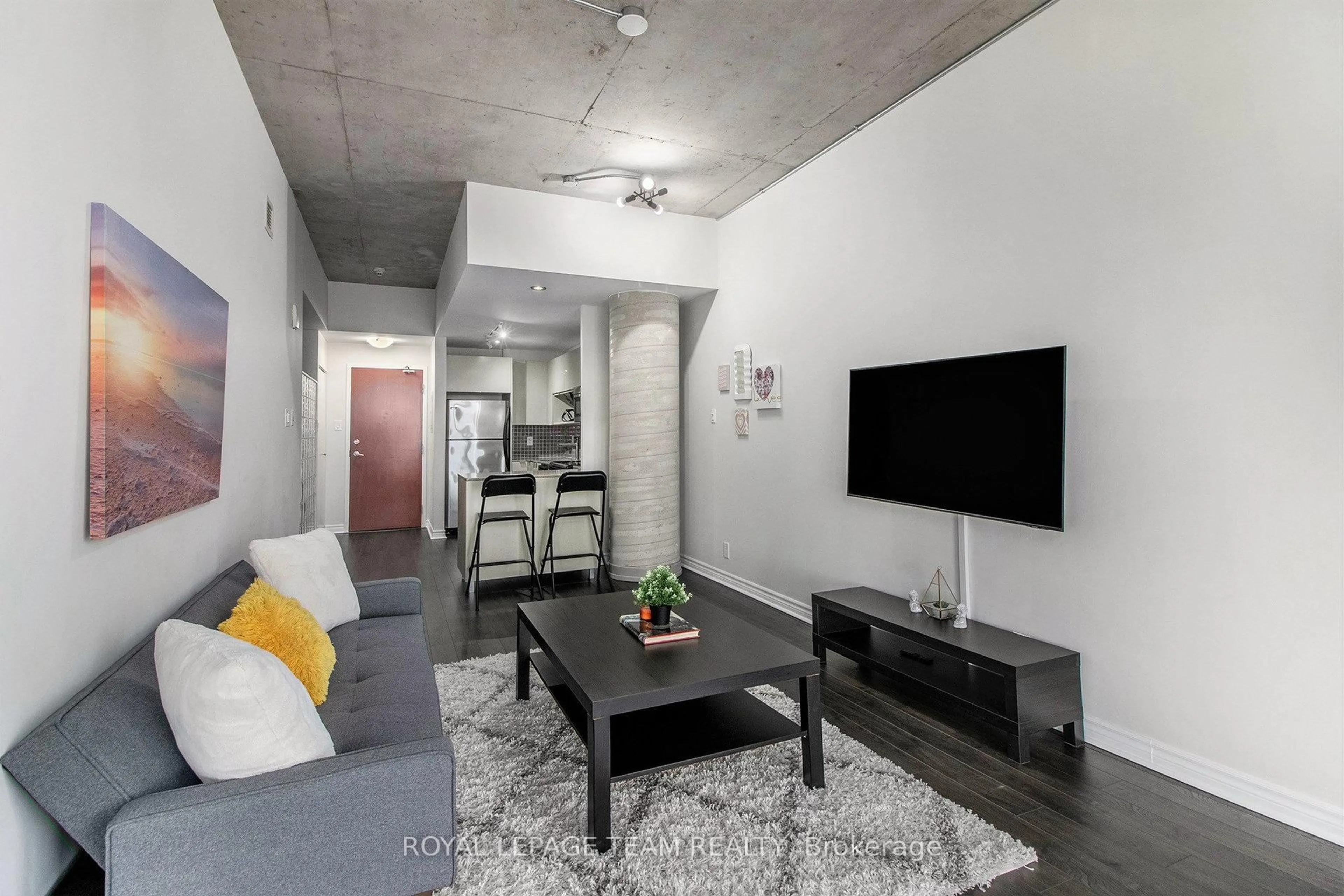 Living room with furniture, cement floor for 324 Laurier Ave #2208, Ottawa Ontario K1N 6P6