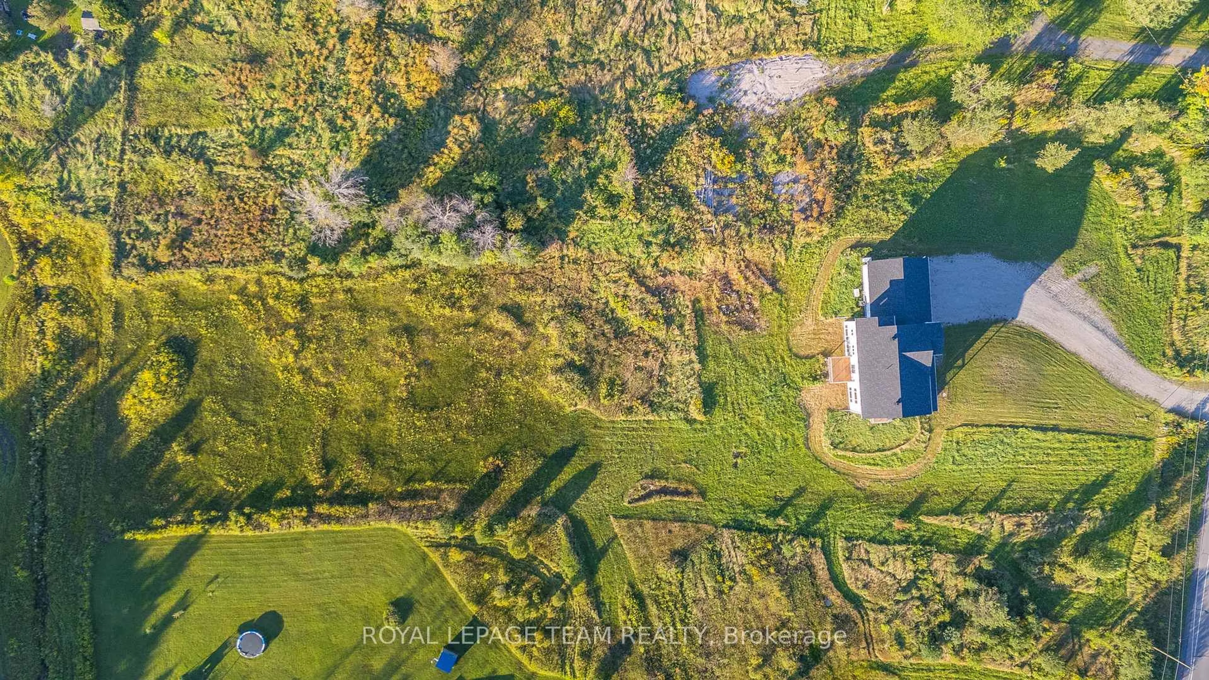 A pic from outside/outdoor area/front of a property/back of a property/a pic from drone, forest/trees view for 1124 Perth Rd, Smiths Falls Ontario K7A 4S7