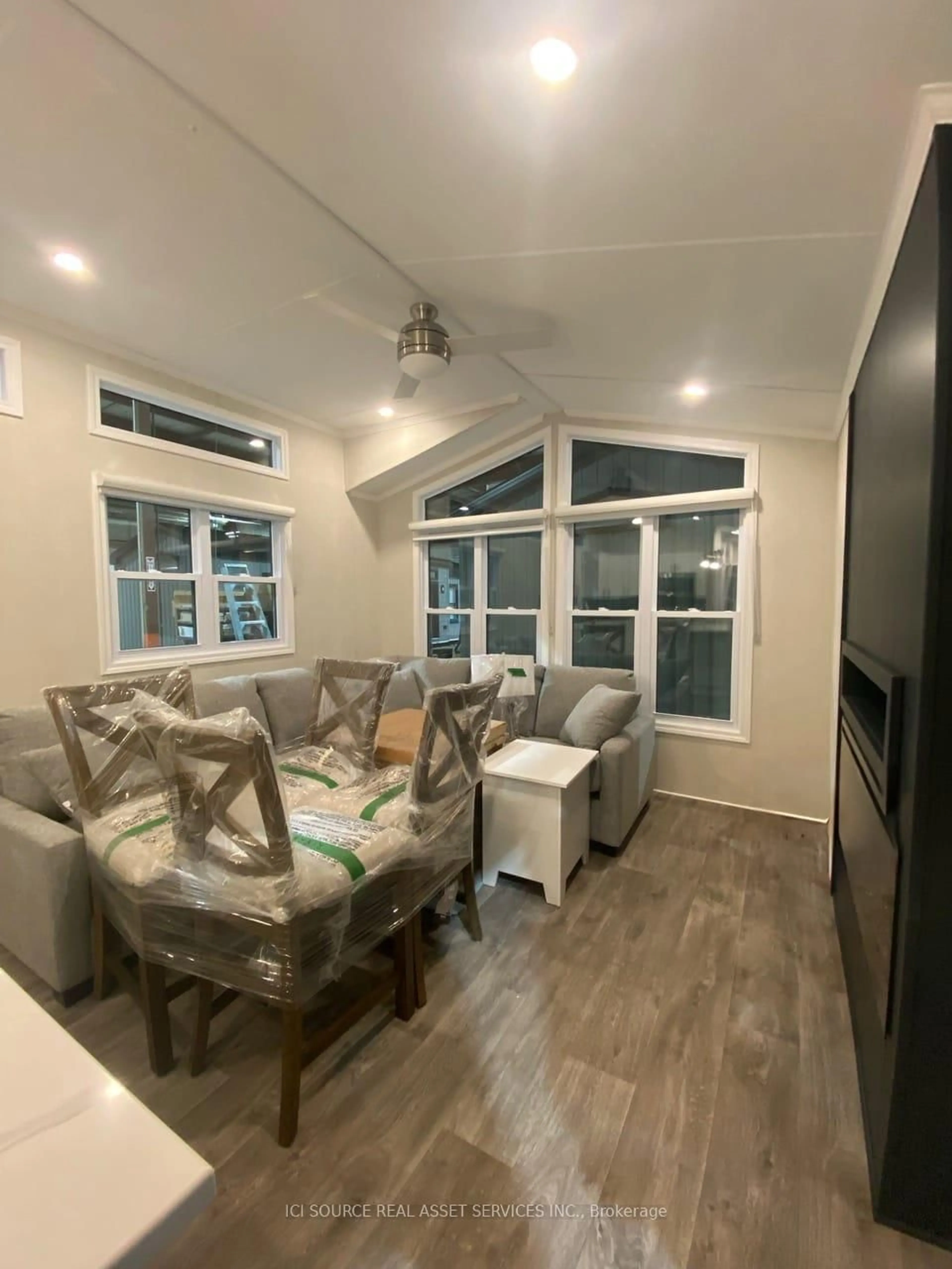 Living room with furniture, wood/laminate floor for 5007 Highway 21 #TCHPE, Saugeen Shores Ontario N0H 2C5