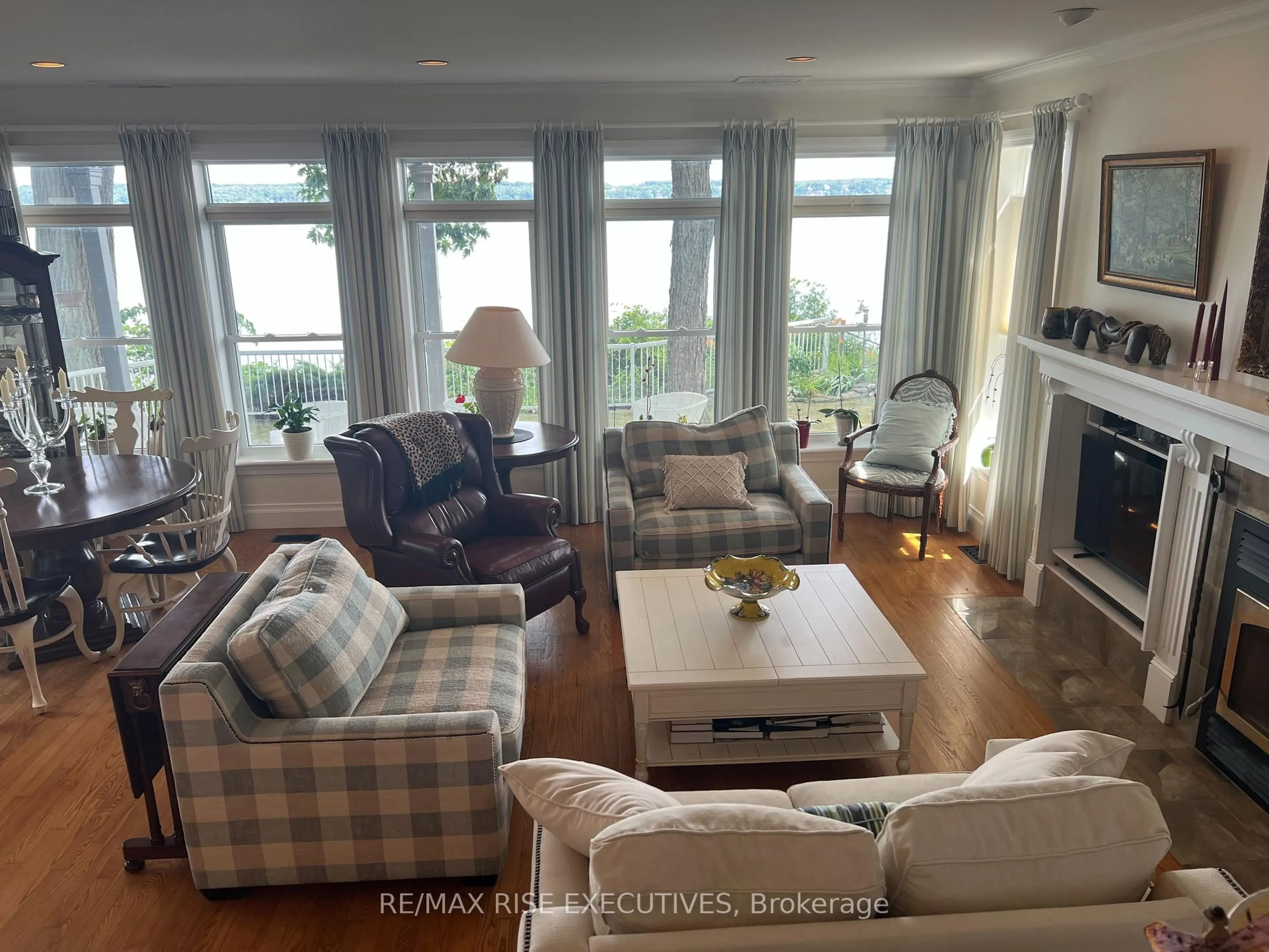 Living room with furniture, wood/laminate floor for 105 Fraser Lane, Elizabethtown-Kitley Ontario K6V 7E2