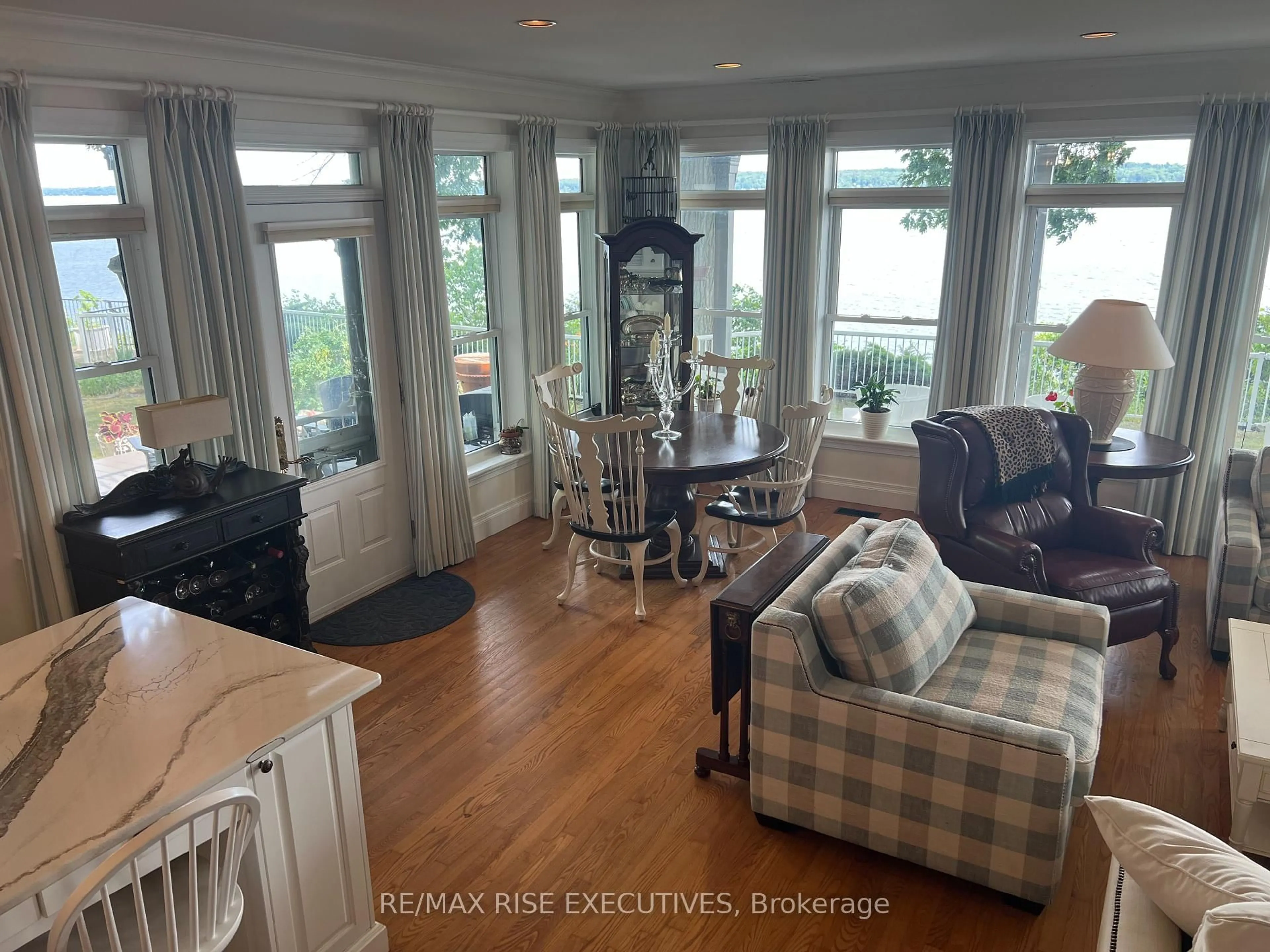 Living room with furniture, wood/laminate floor for 105 Fraser Lane, Elizabethtown-Kitley Ontario K6V 7E2