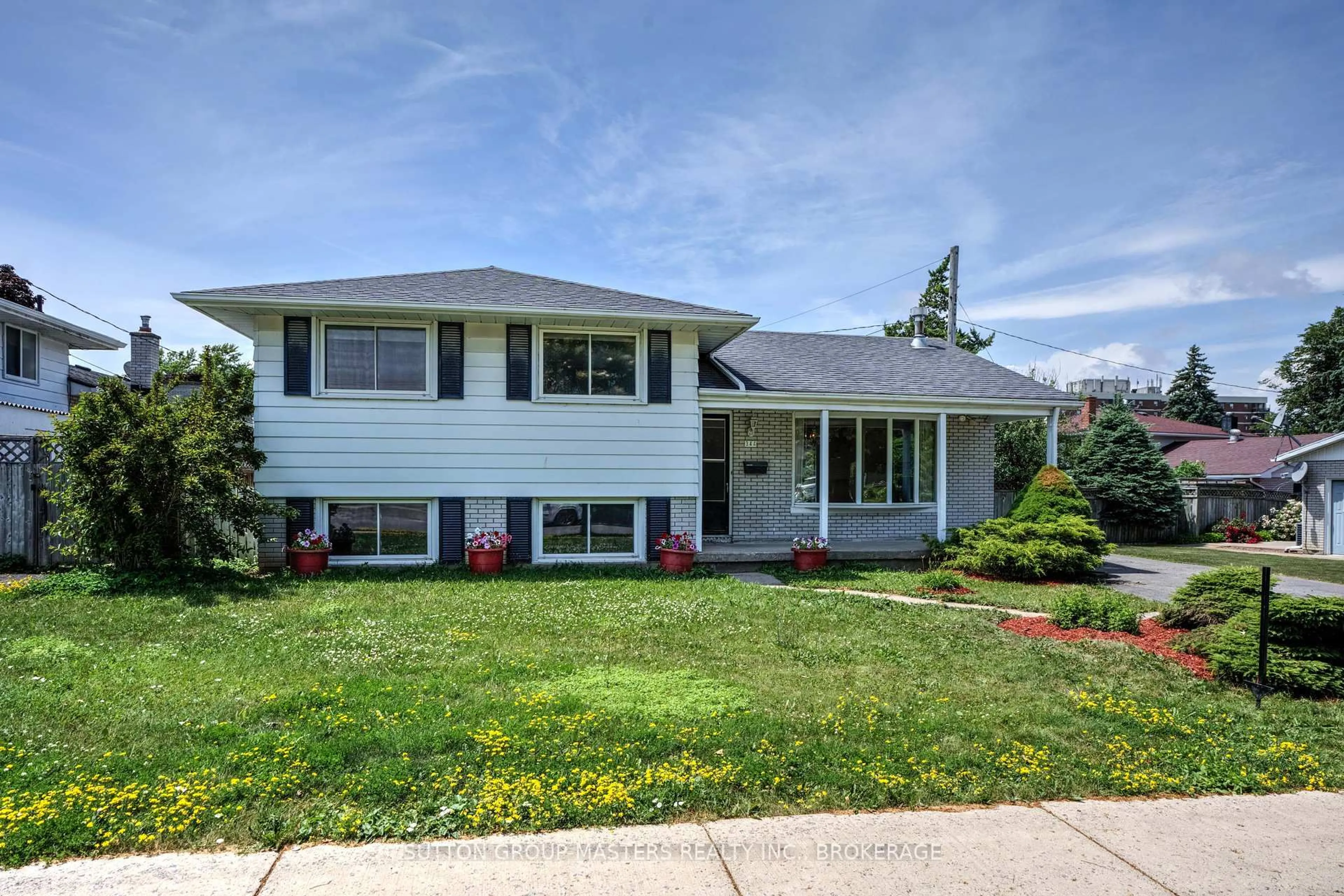 Home with vinyl exterior material, street for 344 Norman Rogers Dr, Kingston Ontario K7M 2R8
