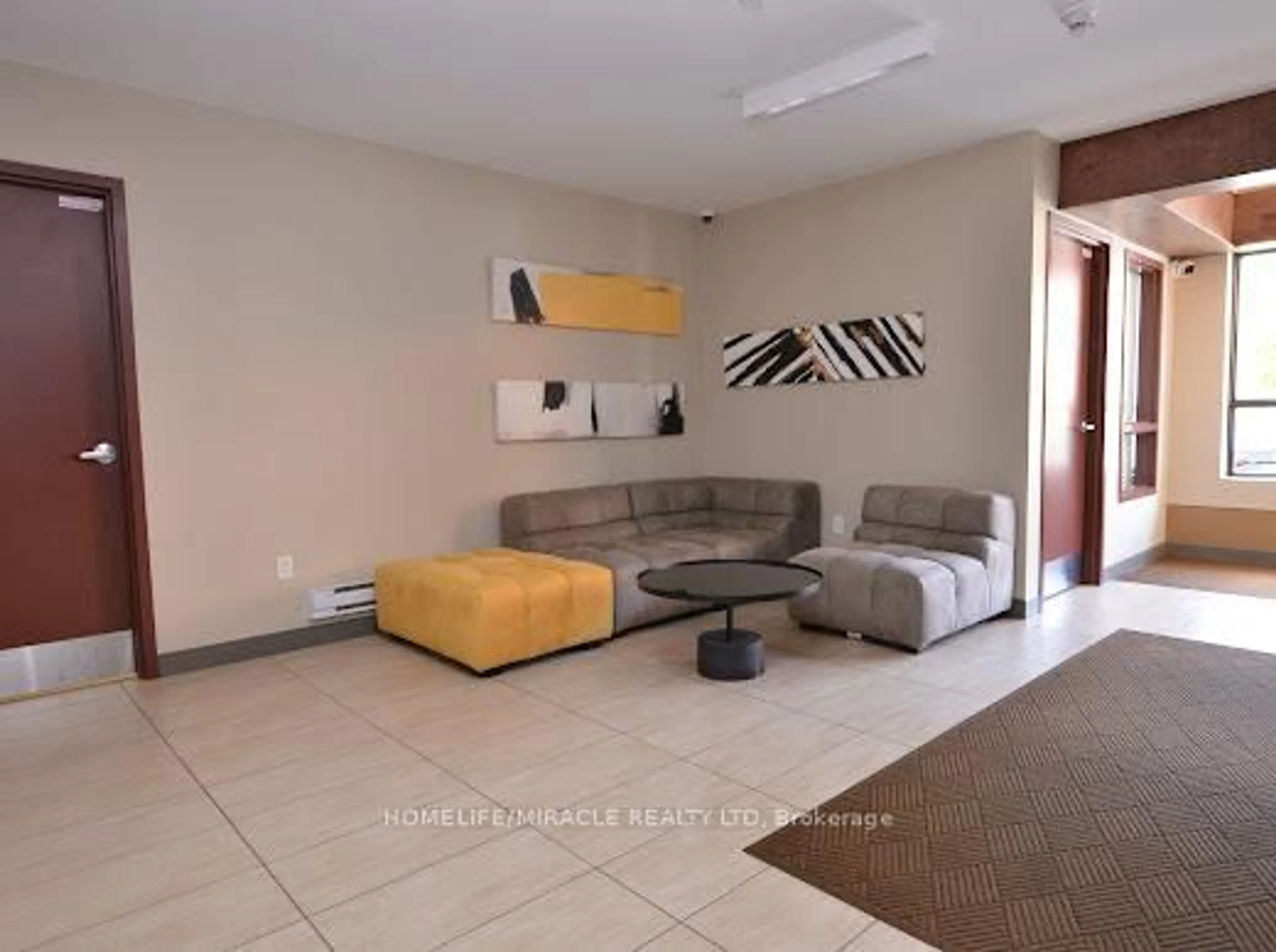 Living room with furniture, unknown for 26 Wellington St #105, St. Catharines Ontario L2R 5P8