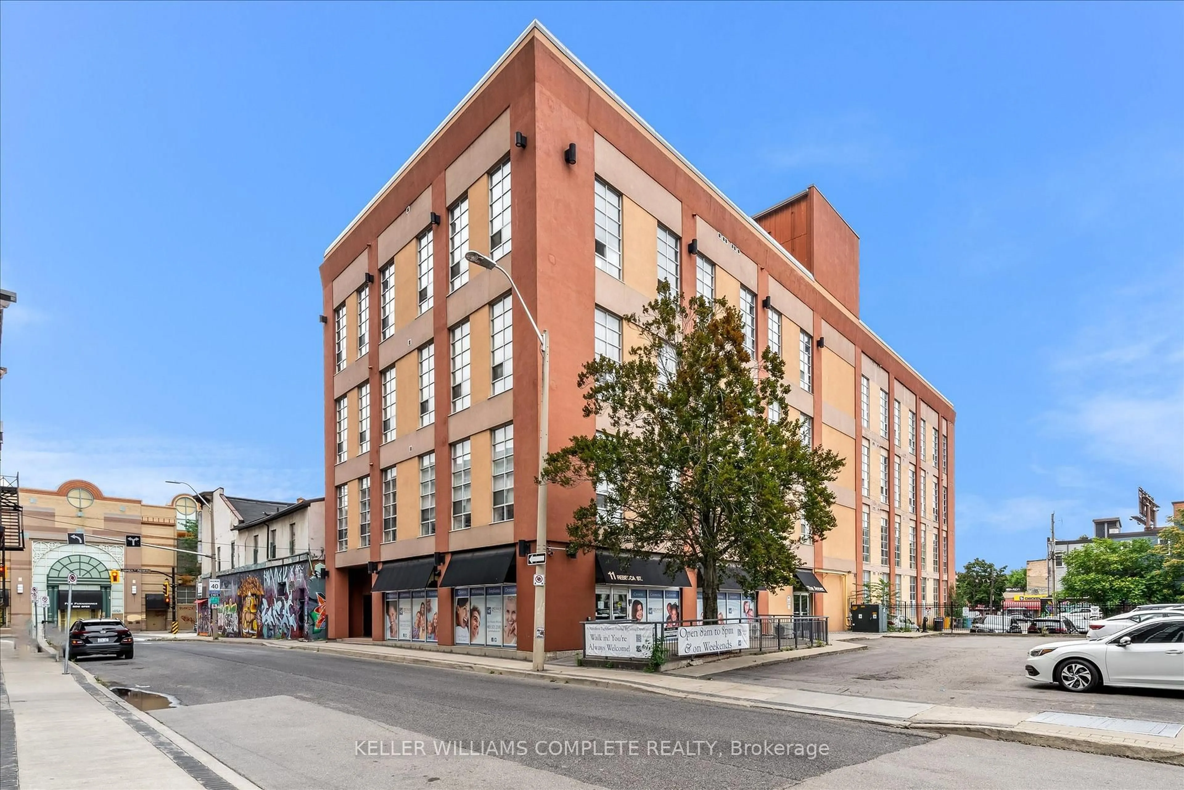 Home with brick exterior material, building for 11 Rebecca St #402, Hamilton Ontario L8R 3H7