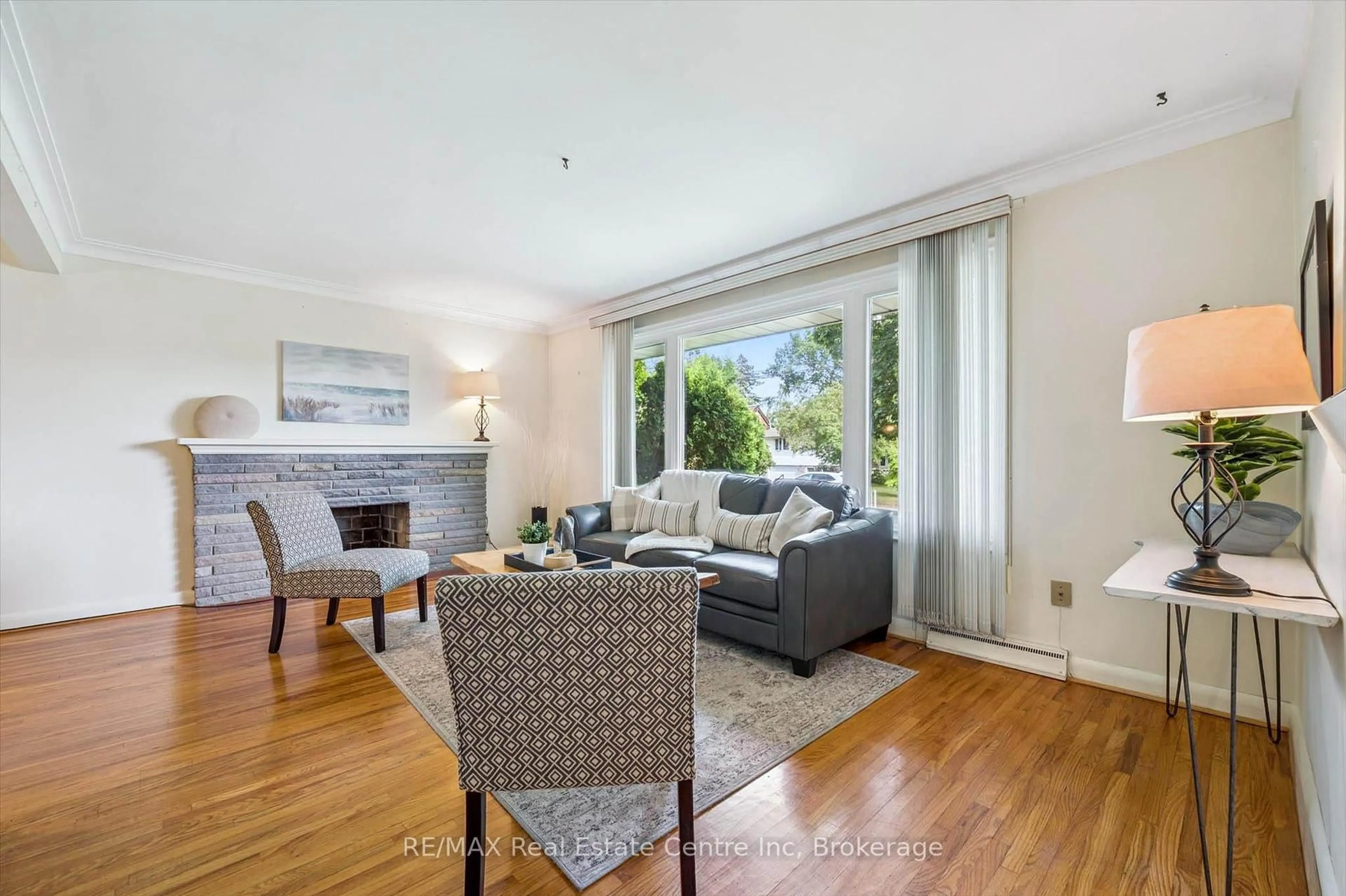 Living room with furniture, wood/laminate floor for 29 Echo Dr, Guelph Ontario N1G 1H1