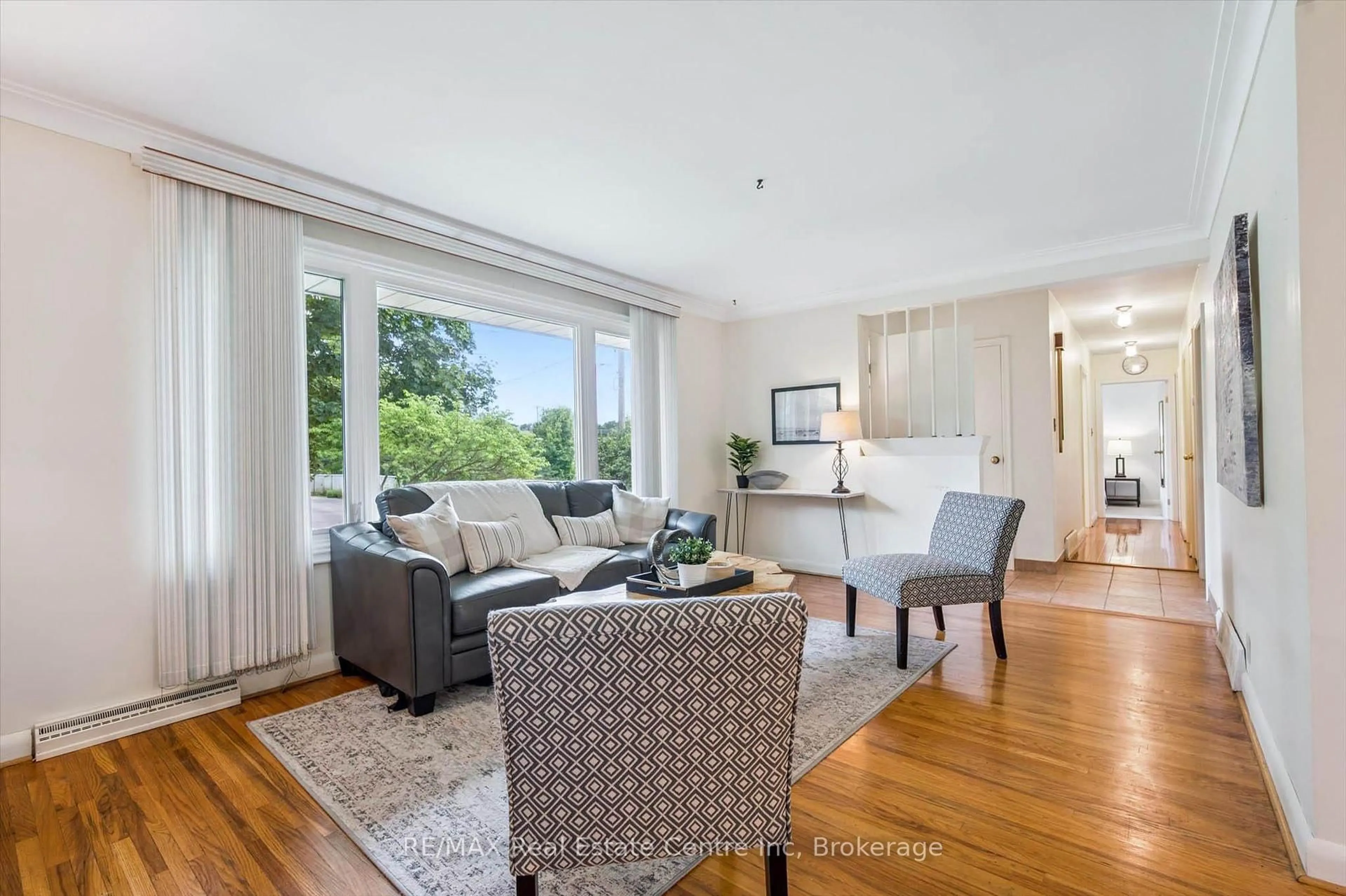 Living room with furniture, wood/laminate floor for 29 Echo Dr, Guelph Ontario N1G 1H1