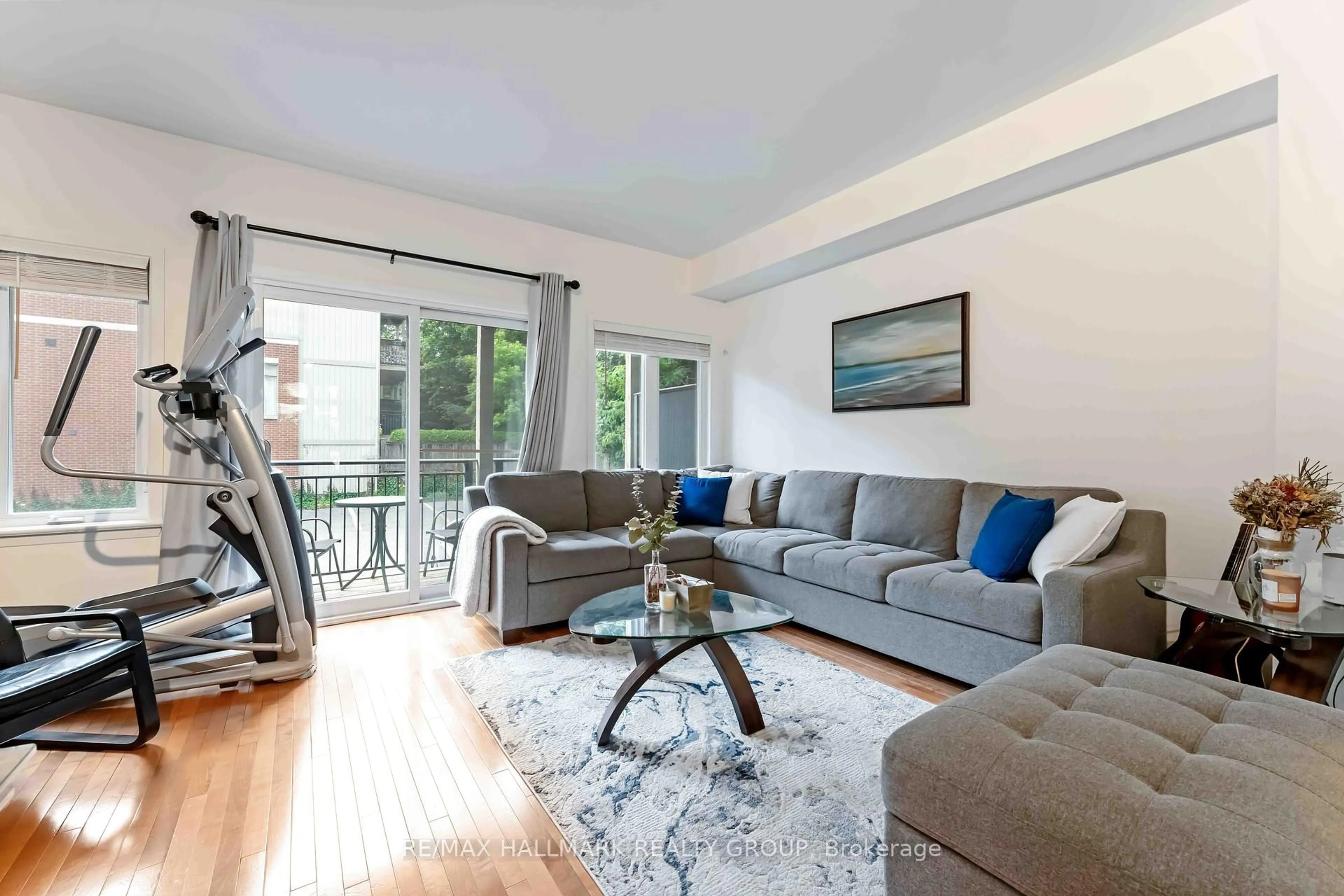 Living room with furniture, wood/laminate floor for 799 Montreal Rd #32, Ottawa Ontario K1K 0S9