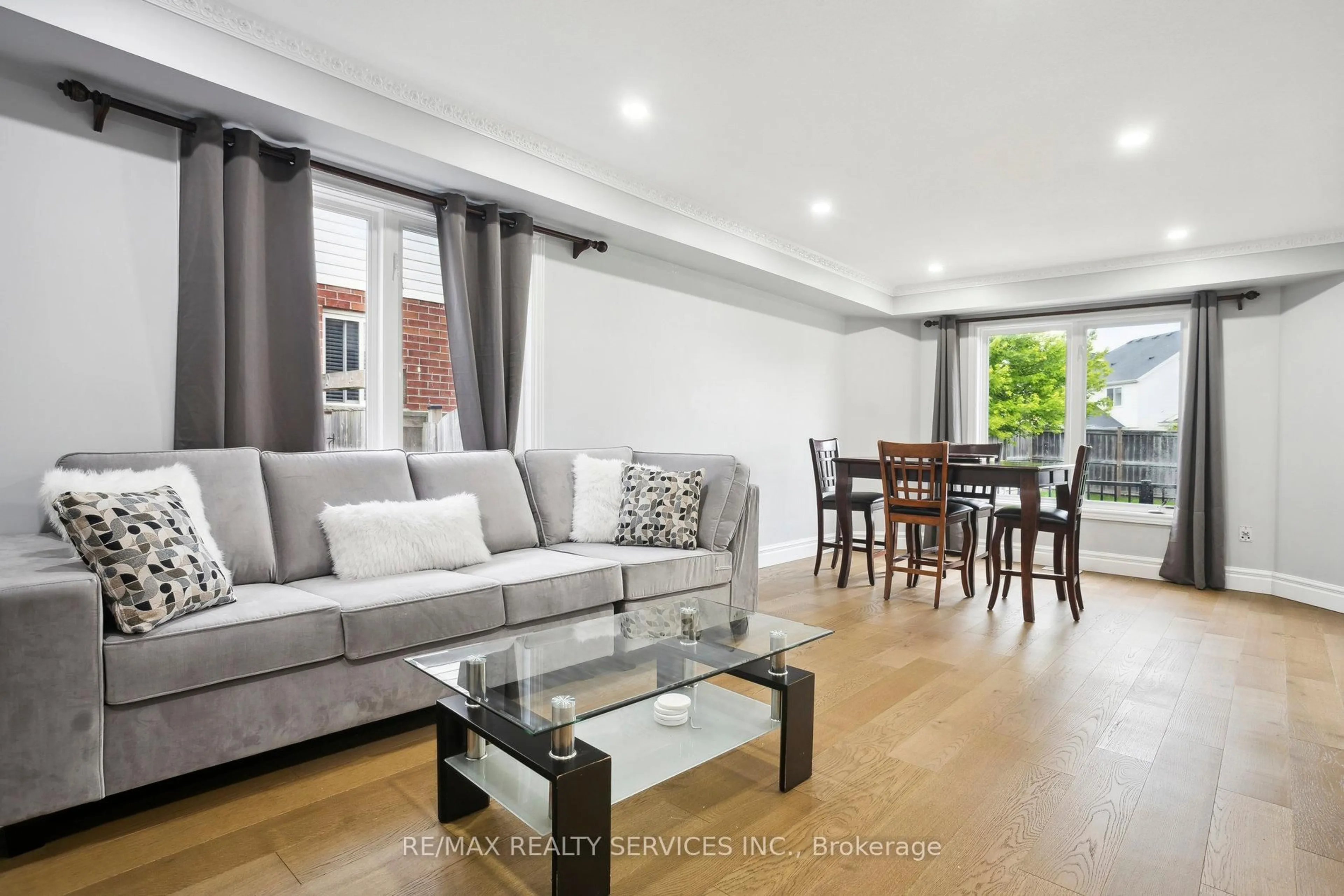 Living room with furniture, wood/laminate floor for 1182 Silverfox Dr, London North Ontario N6G 0C8