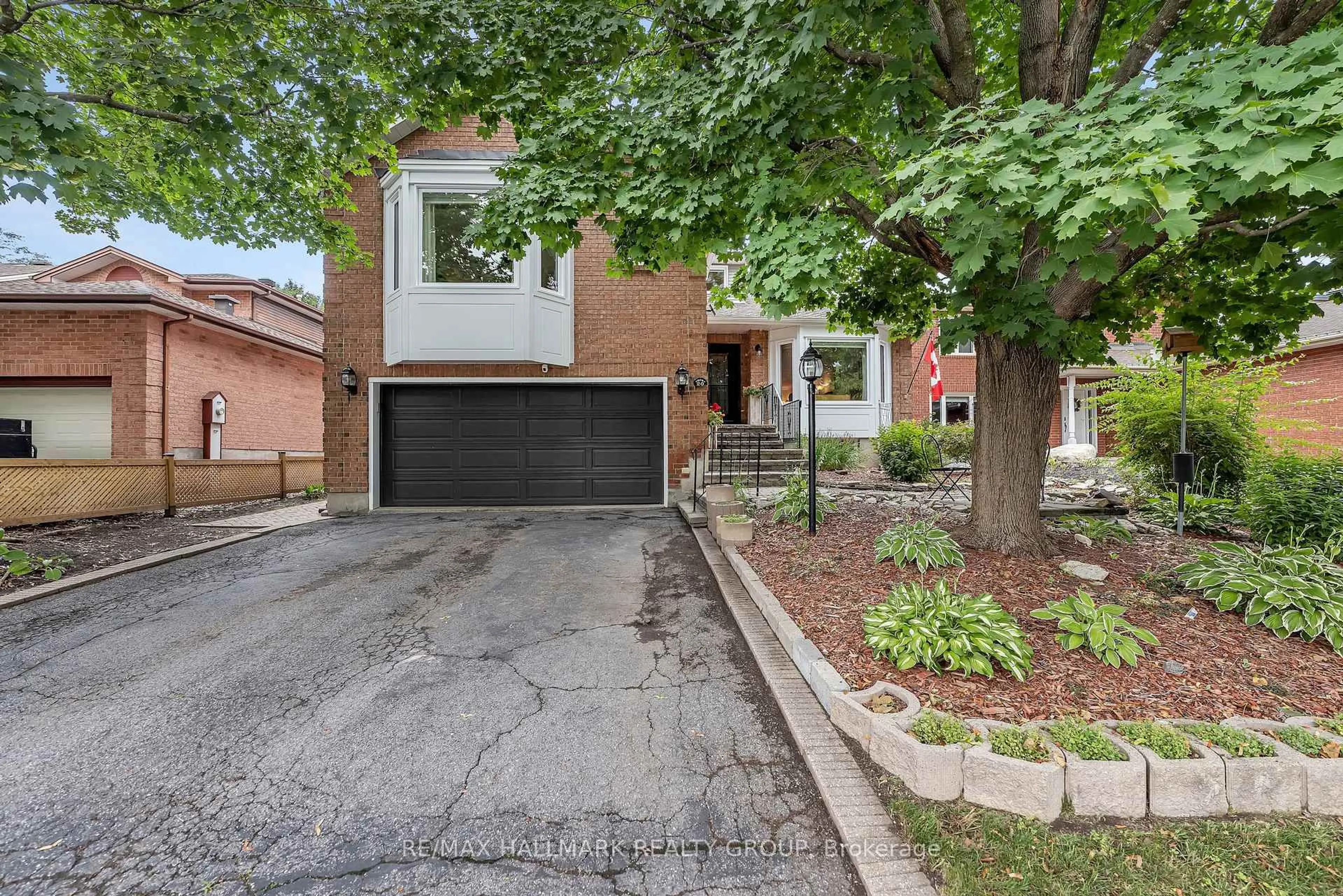 Home with brick exterior material, street for 20 Bluemeadow Way, Ottawa Ontario K2M 1L6