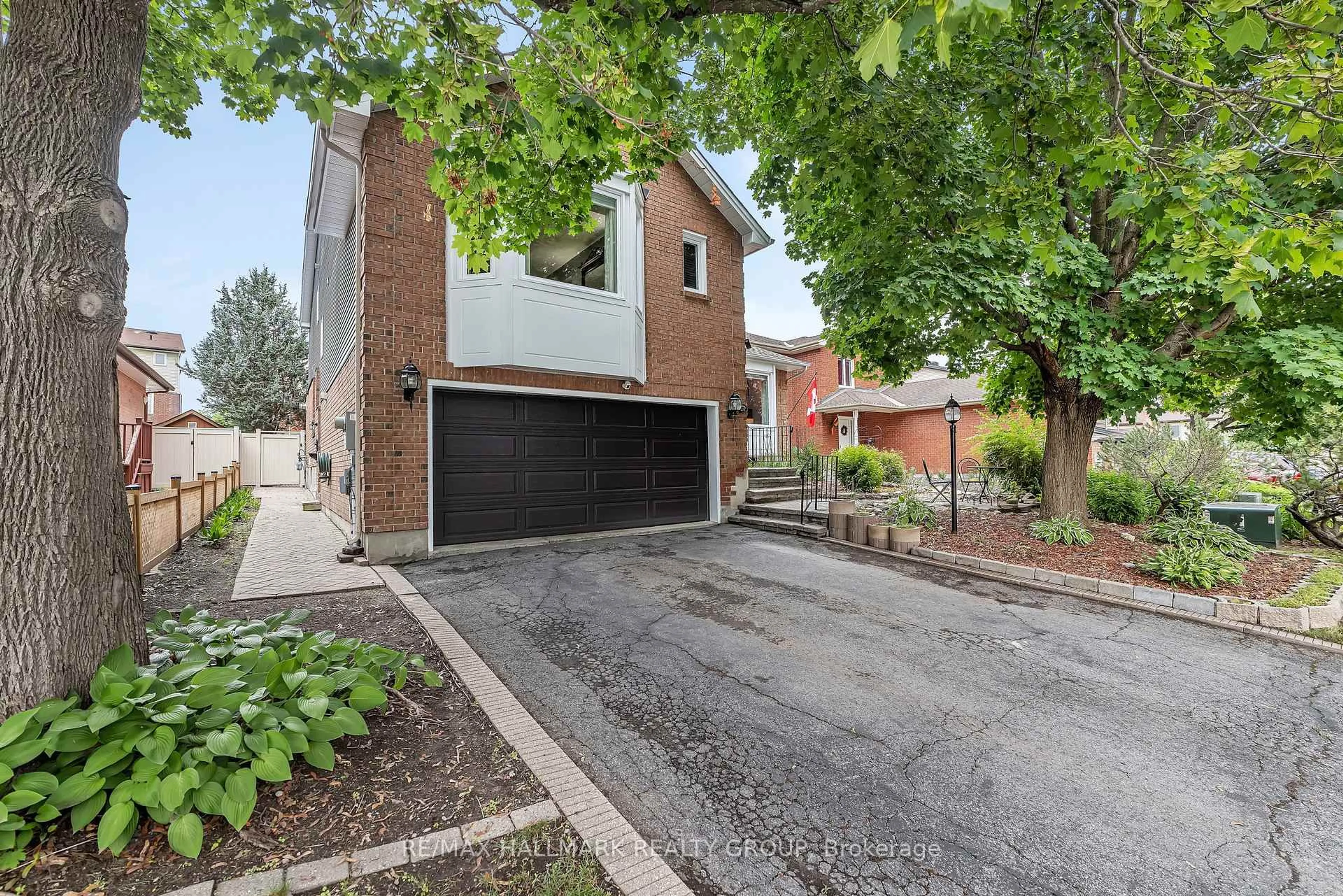 Home with brick exterior material, street for 20 Bluemeadow Way, Ottawa Ontario K2M 1L6